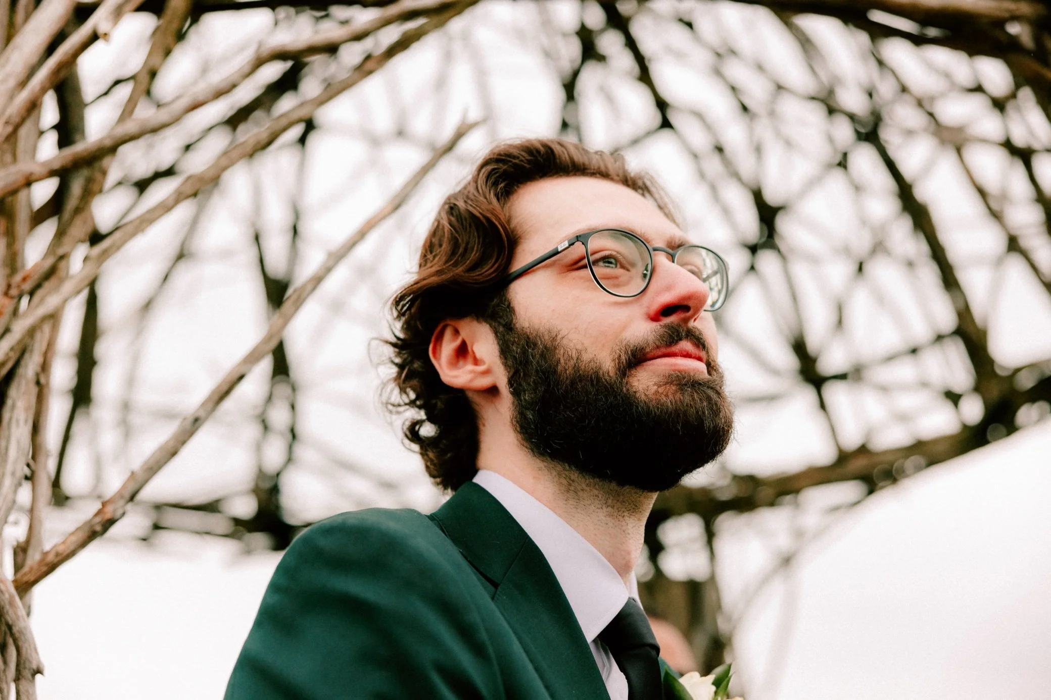  groom crying as bride walks down the aisle at the garrison 