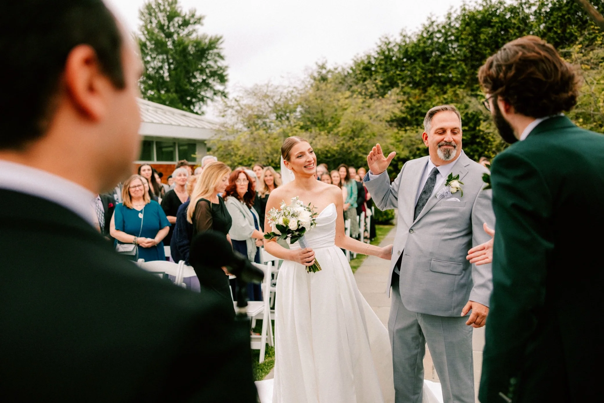  bride walking down aisle during wedding ceremony at the garrison 