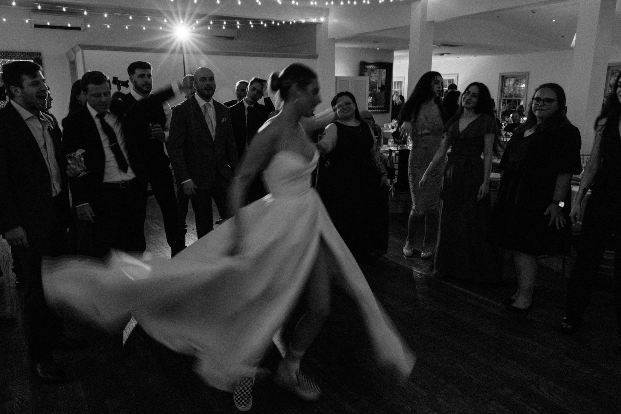  hudson valley documentary film wedding photograph of bride spinning at the garrison 