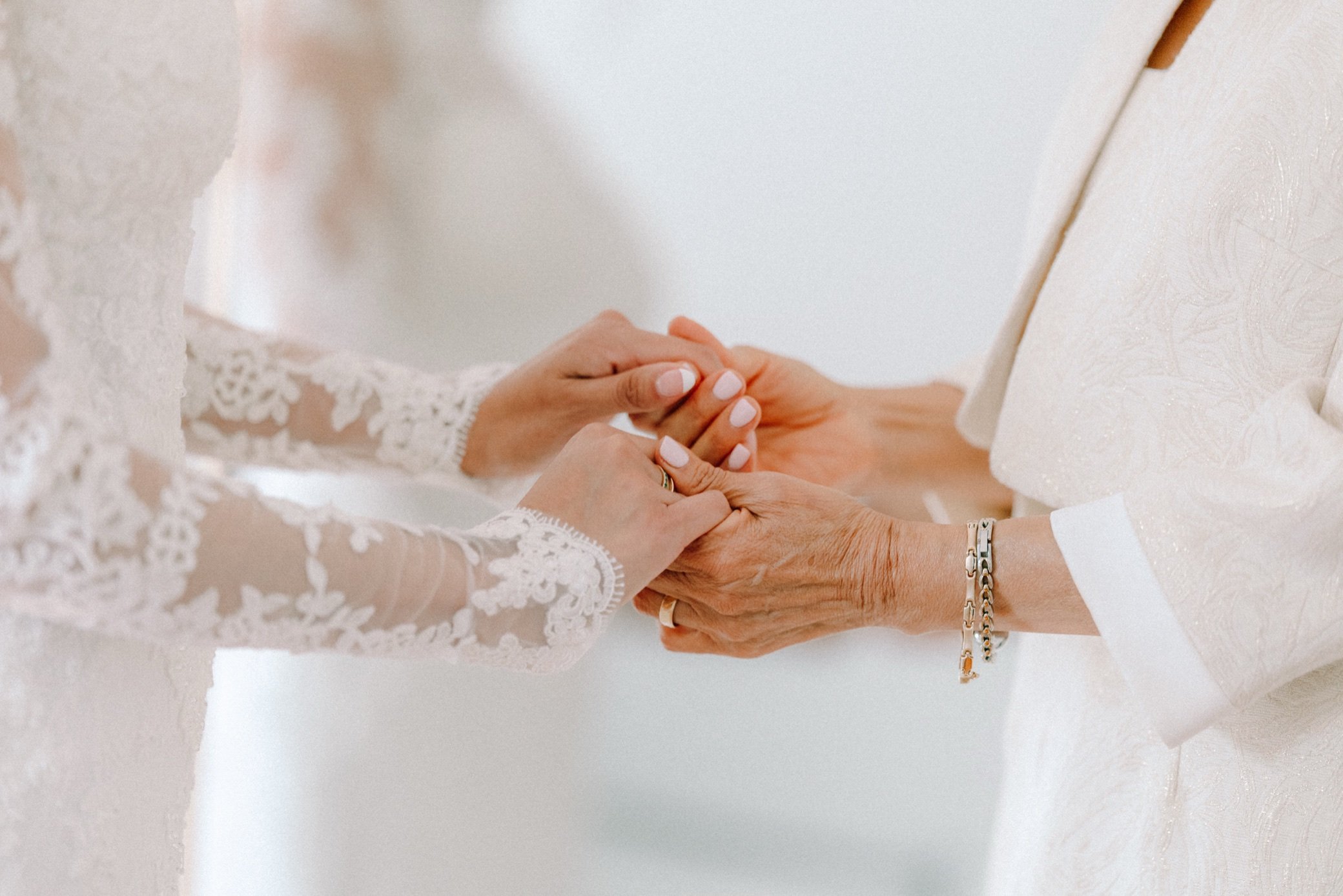  bride holds hands with her mom before her elopement in the hudson valley 