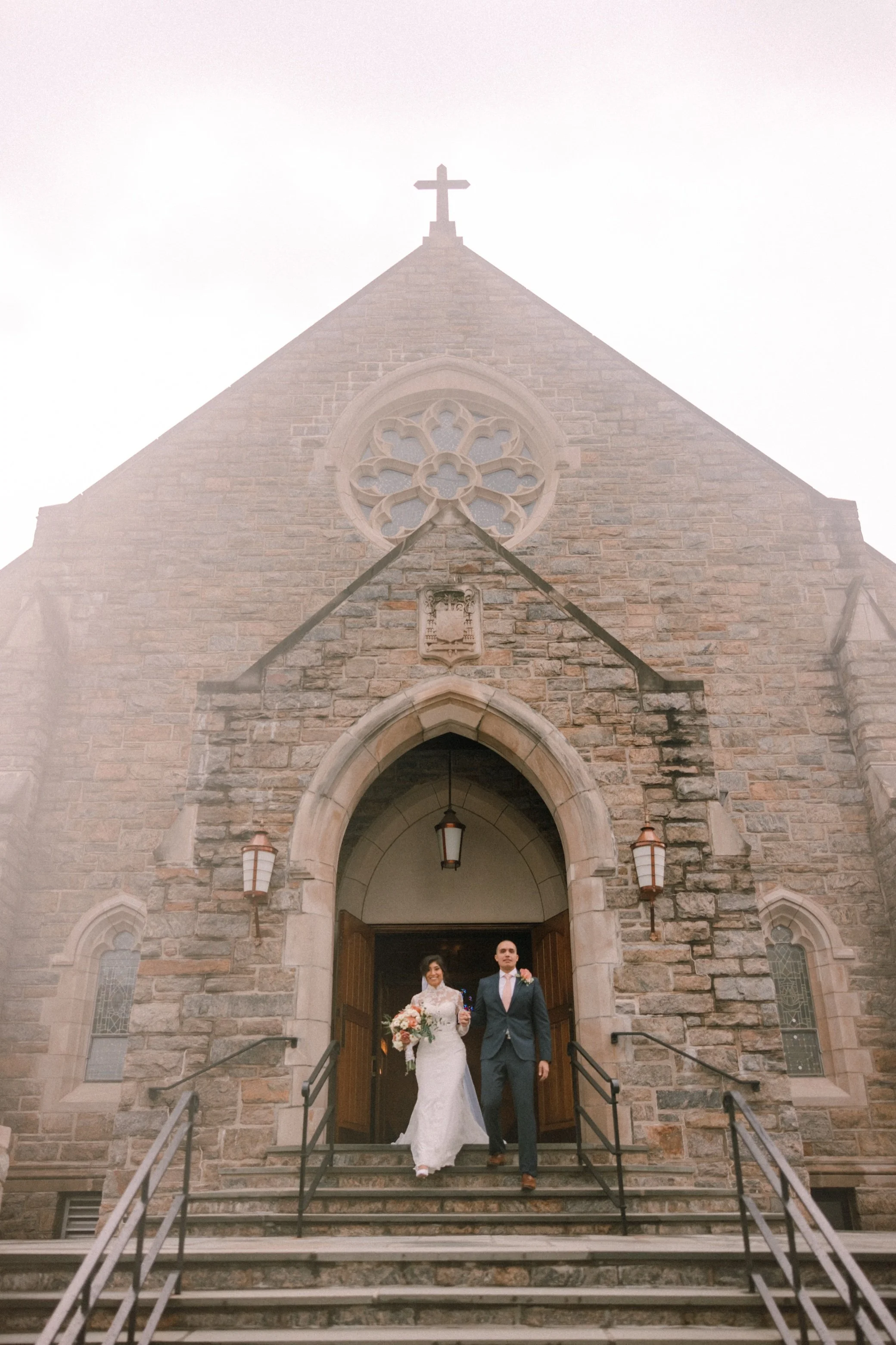  bride and groom exit church after their hudson valley wedding ceremony 