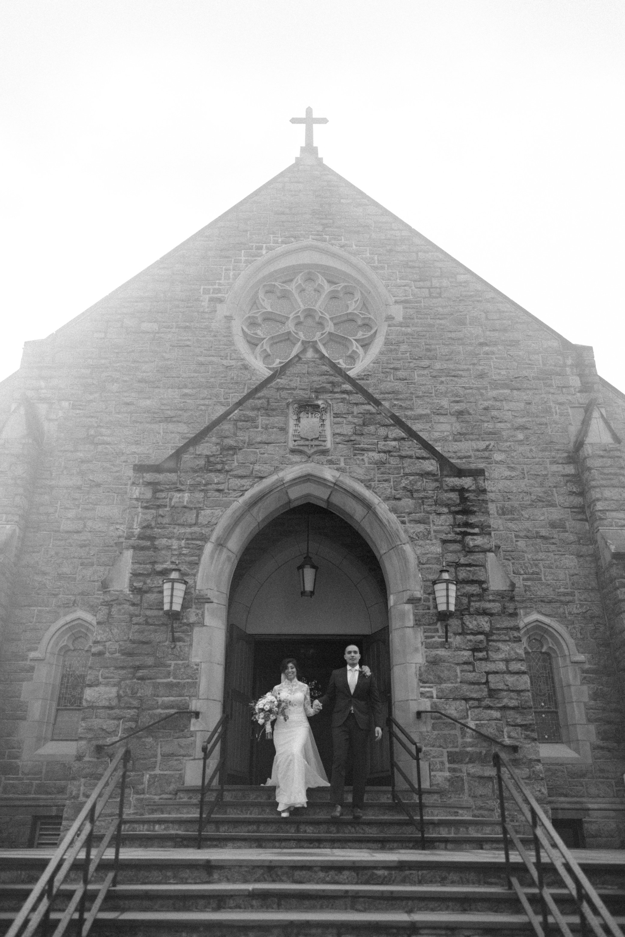  wedding couple exit church after their elopement in the hudson valley 