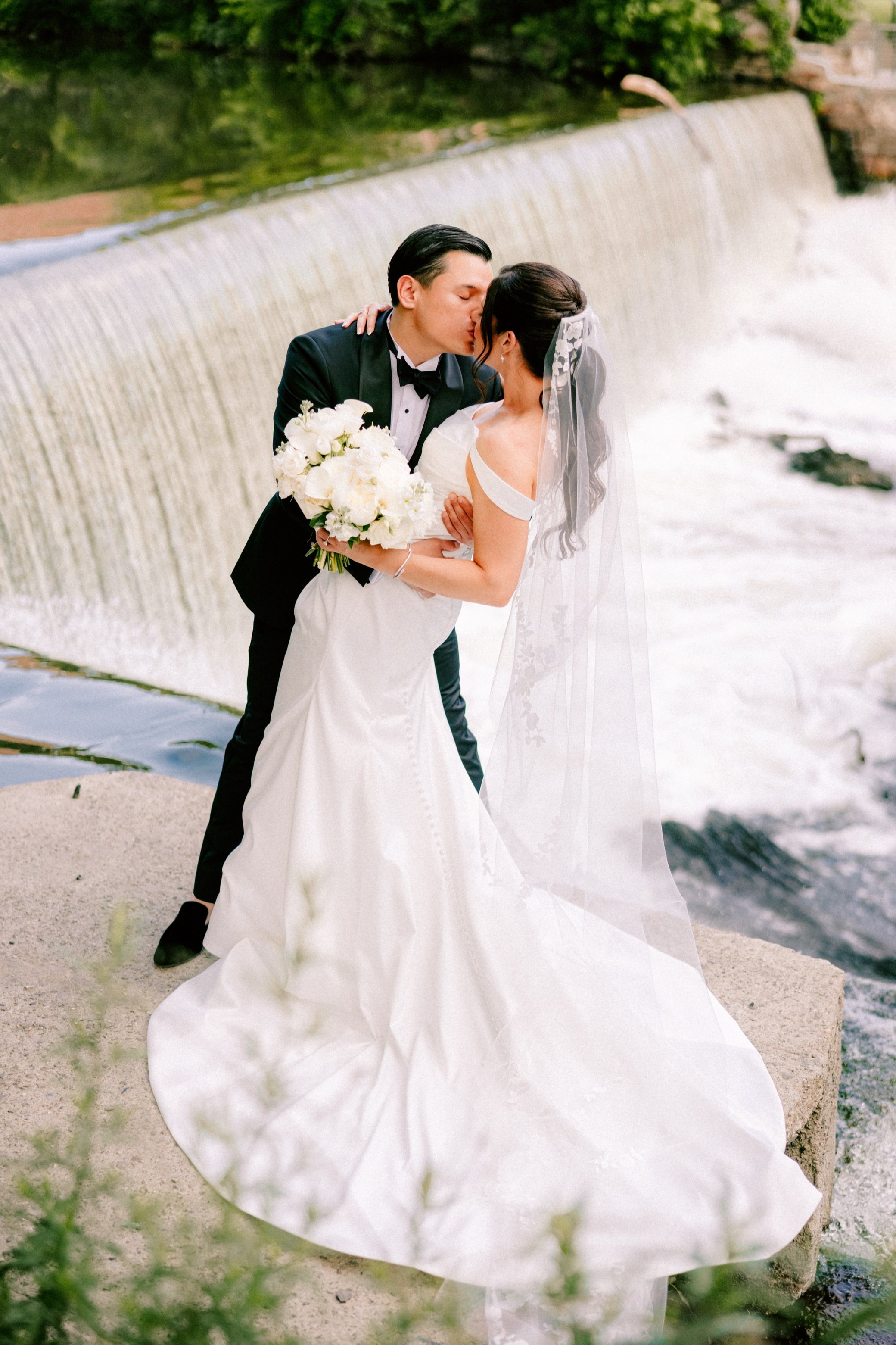  the roundhouse wedding photograph of couple in front of Beacon Falls waterfall in Beacon, NY 