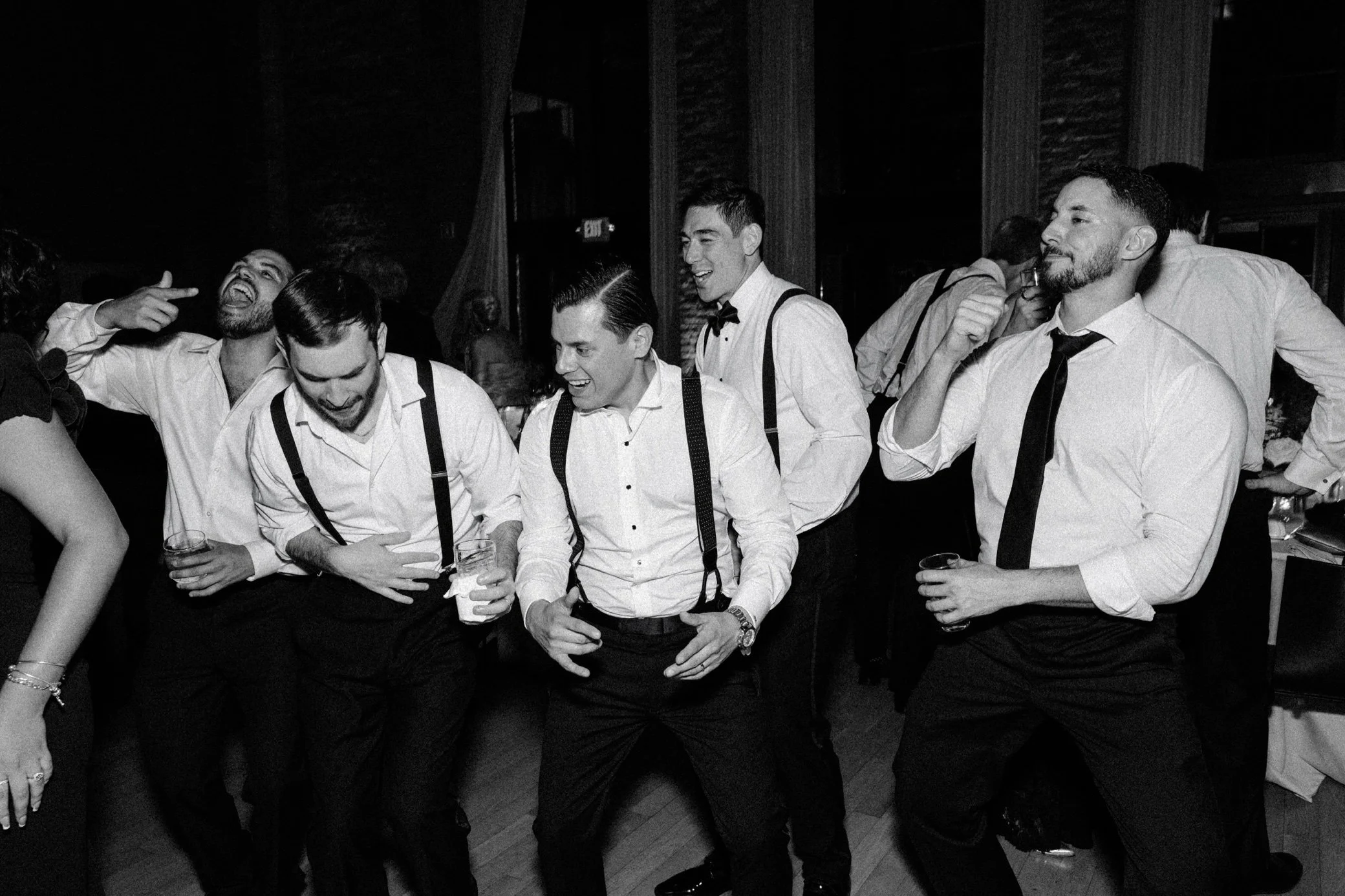  film photograph of hudson valley wedding reception at the roundhouse with groom and groomsmen dancing 