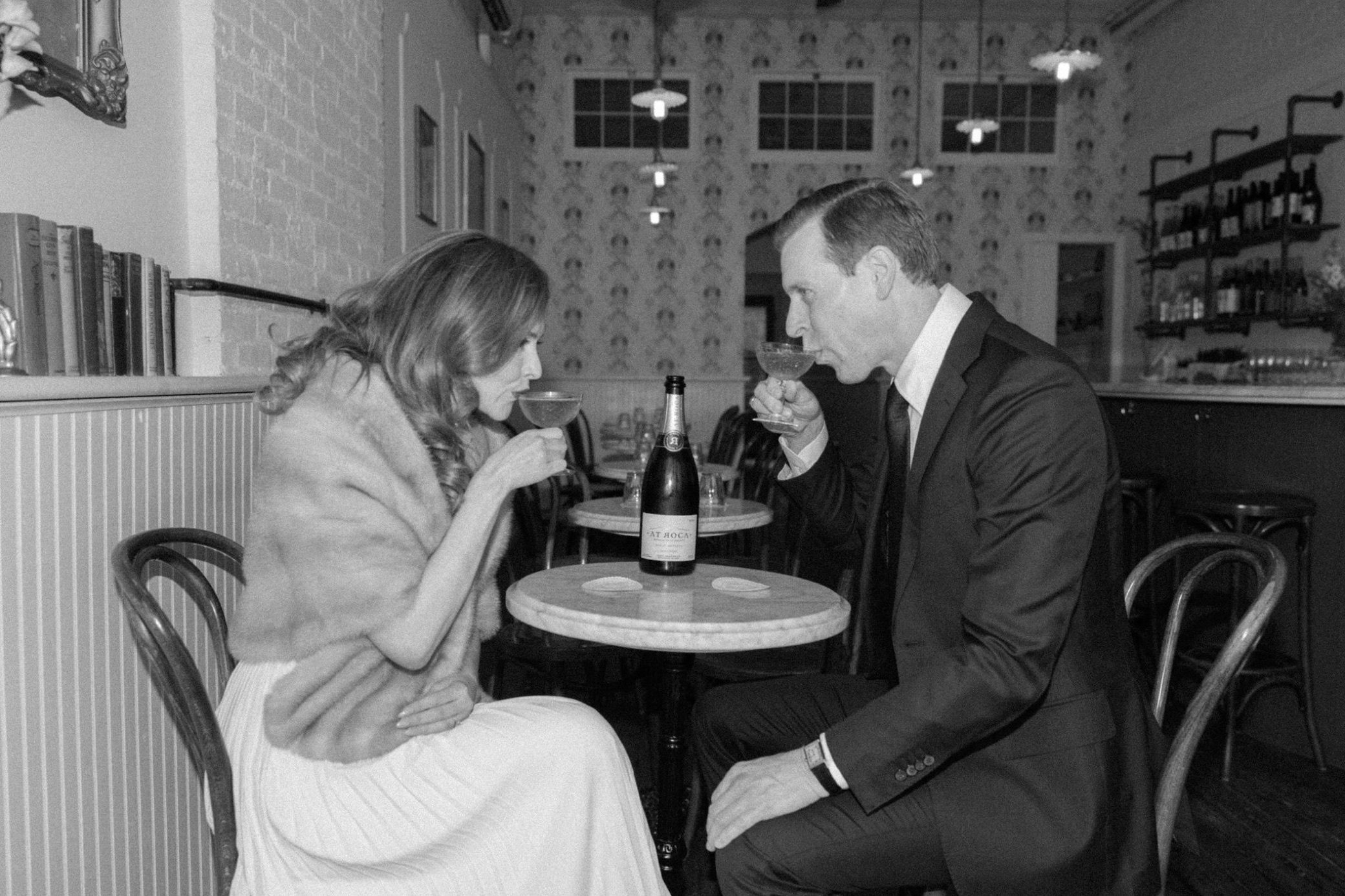  engaged couple enjoy wine at brunette in kingston, ny 