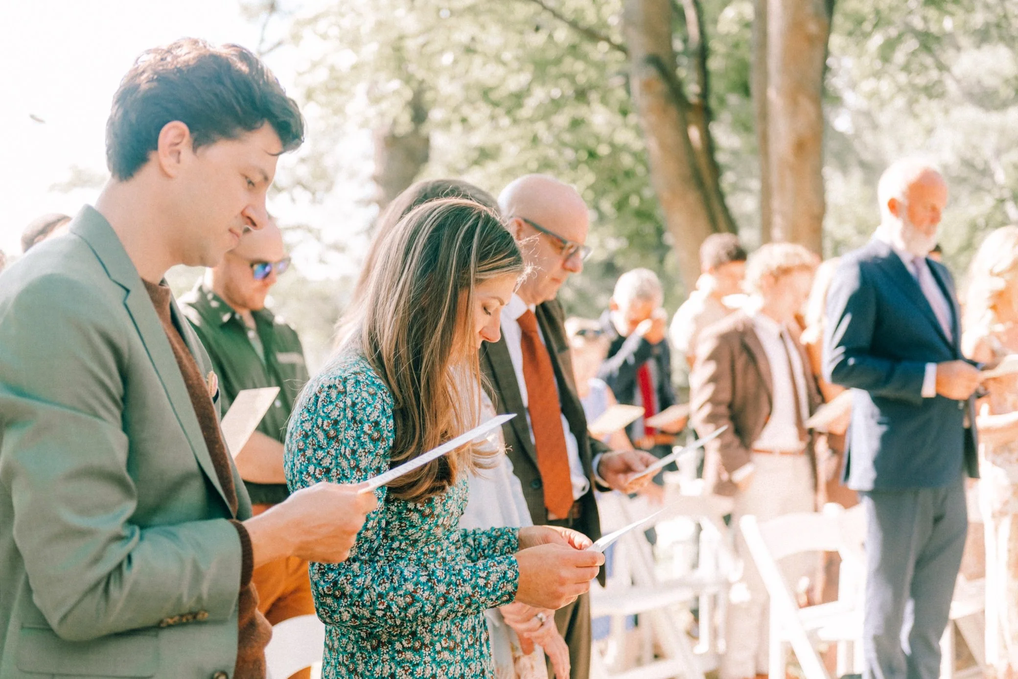  wedding guests singing hymns during outdoor ceremony at The Yard in Beacon, NY 