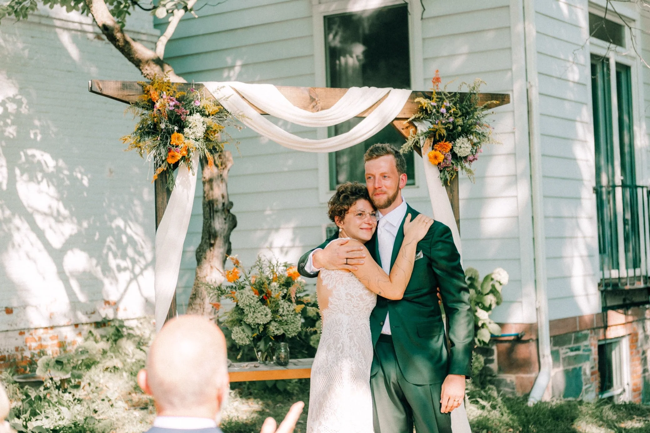  bride and groom embrace during their outdoor wedding ceremony in Beacon, nY 