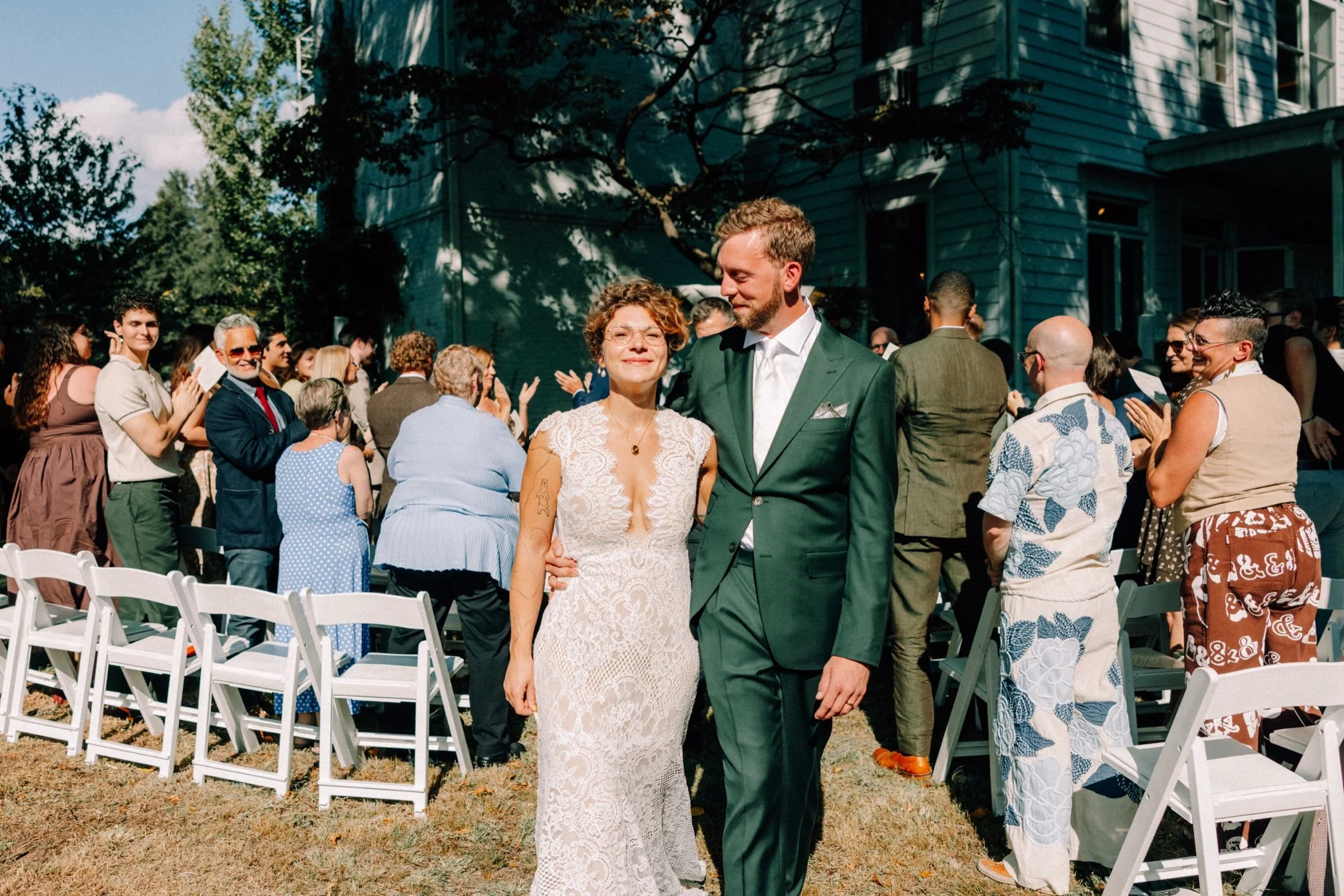  bride and groom walk down aisle in the sunshine at the yard in beacon, ny 