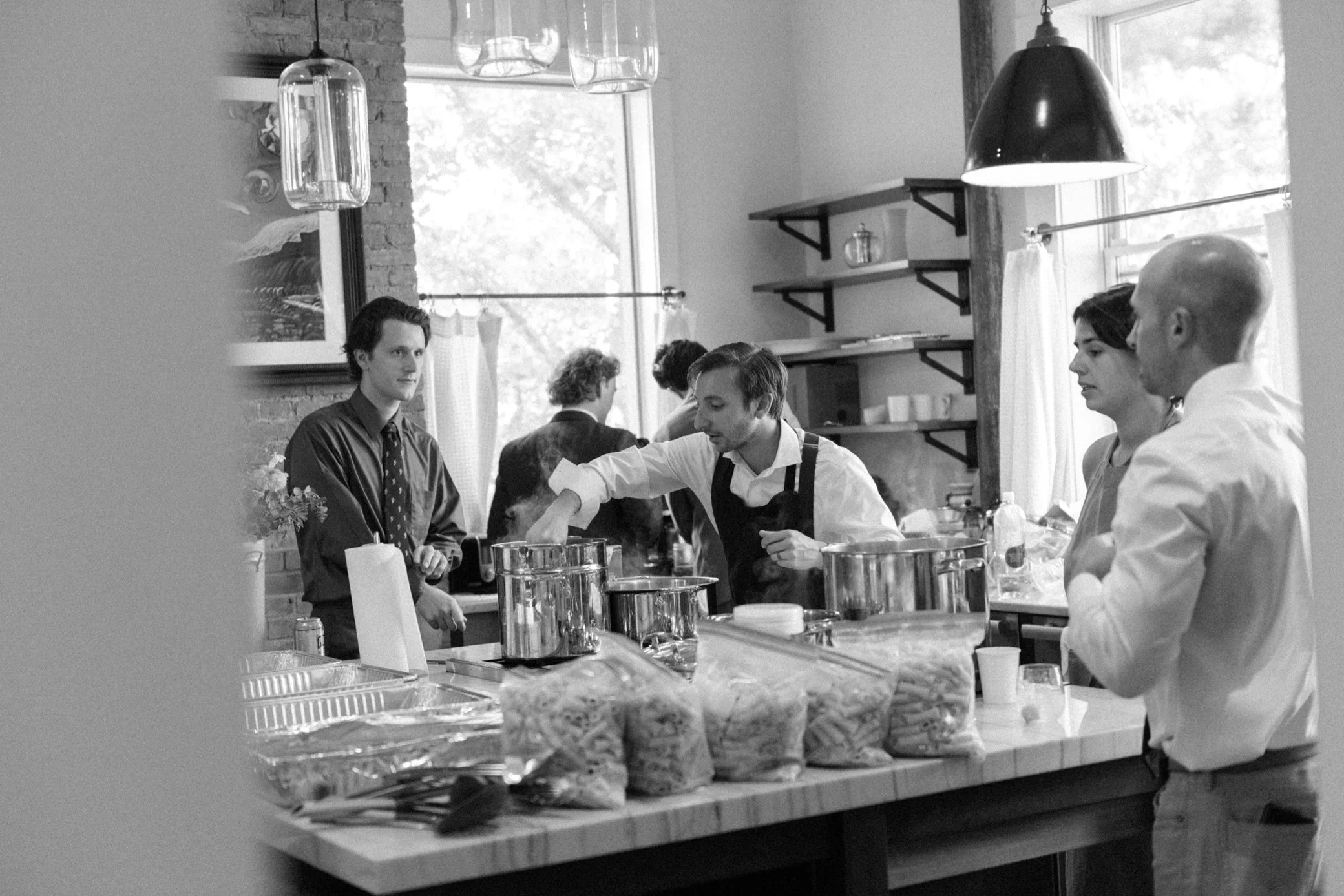  chef stirs food in the kitchen of The Yard mansion in Beacon, NY 