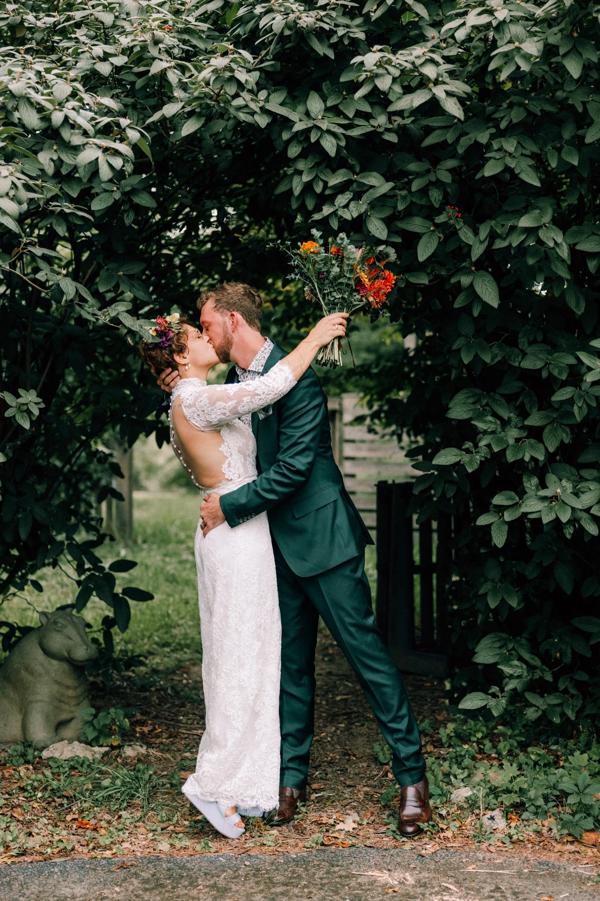  wedding couple kiss under a tree at the yard in beacon, ny 
