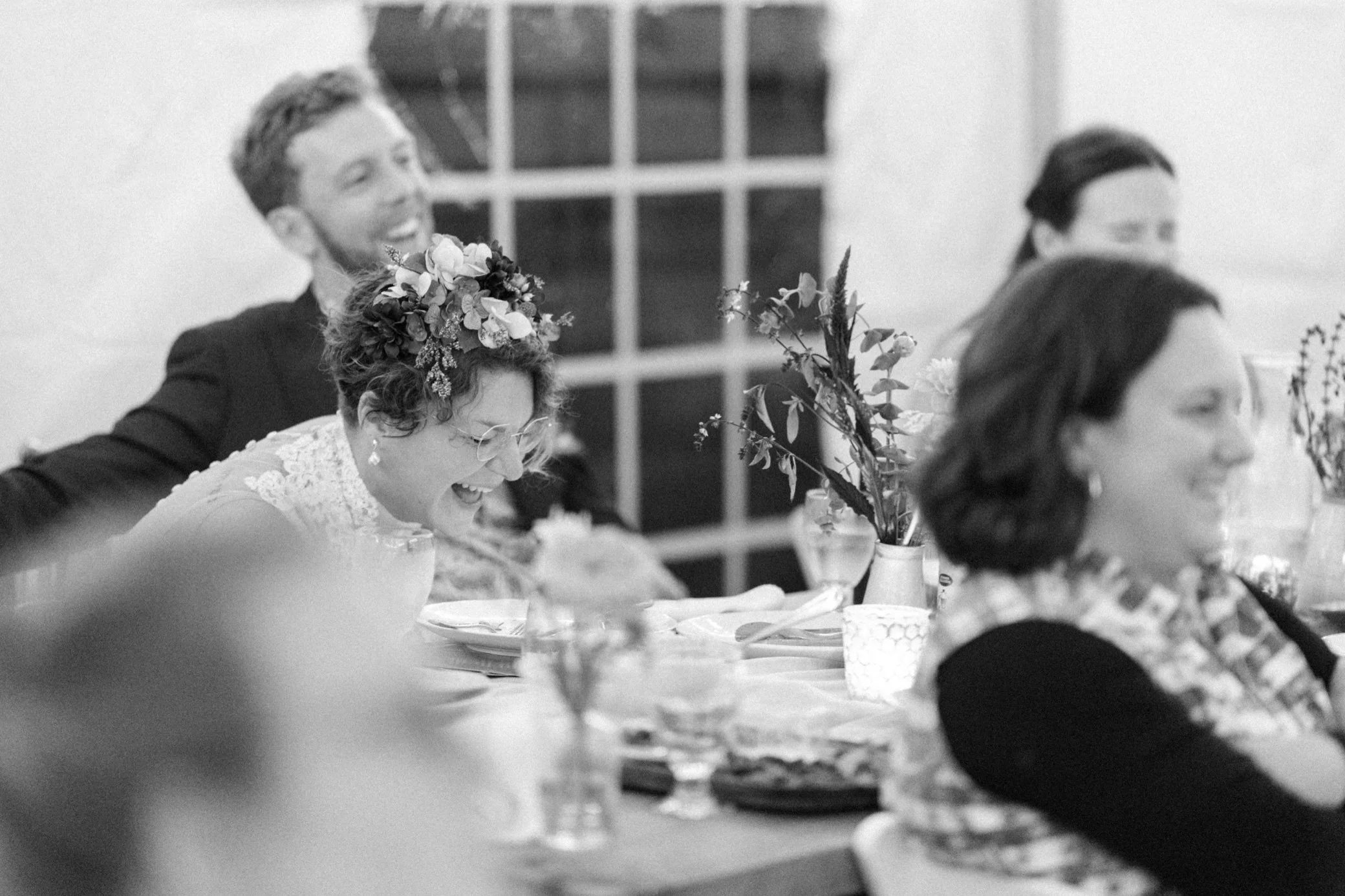  bride and groom laugh during wedding reception toasts at beacon, ny 