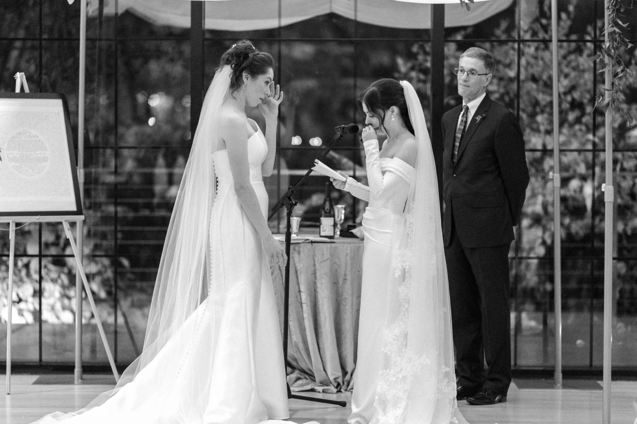  brides wipe away tears during vows at the roundhouse in beacon, ny 
