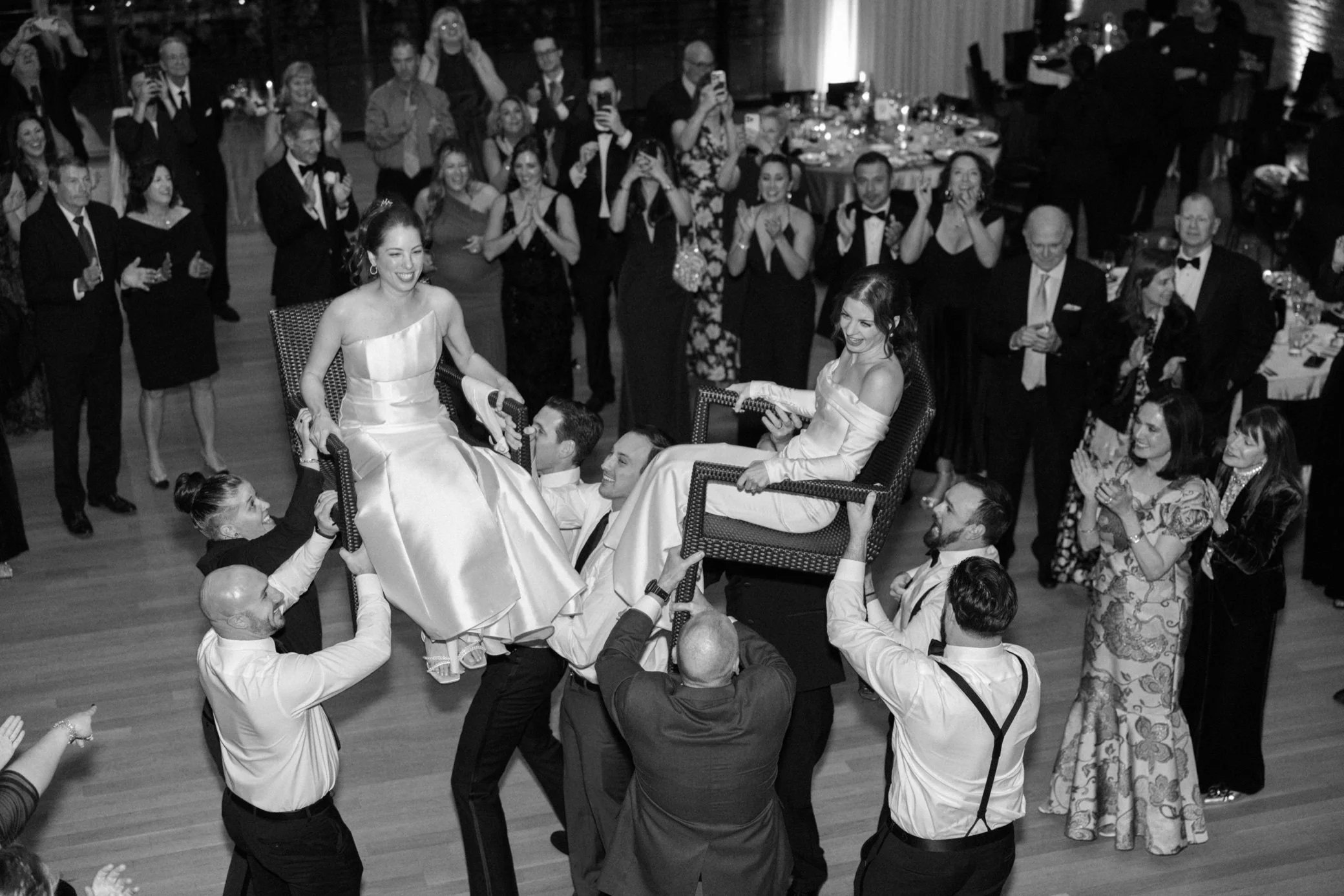  brides lifted on chairs during the hora at the roundhouse 