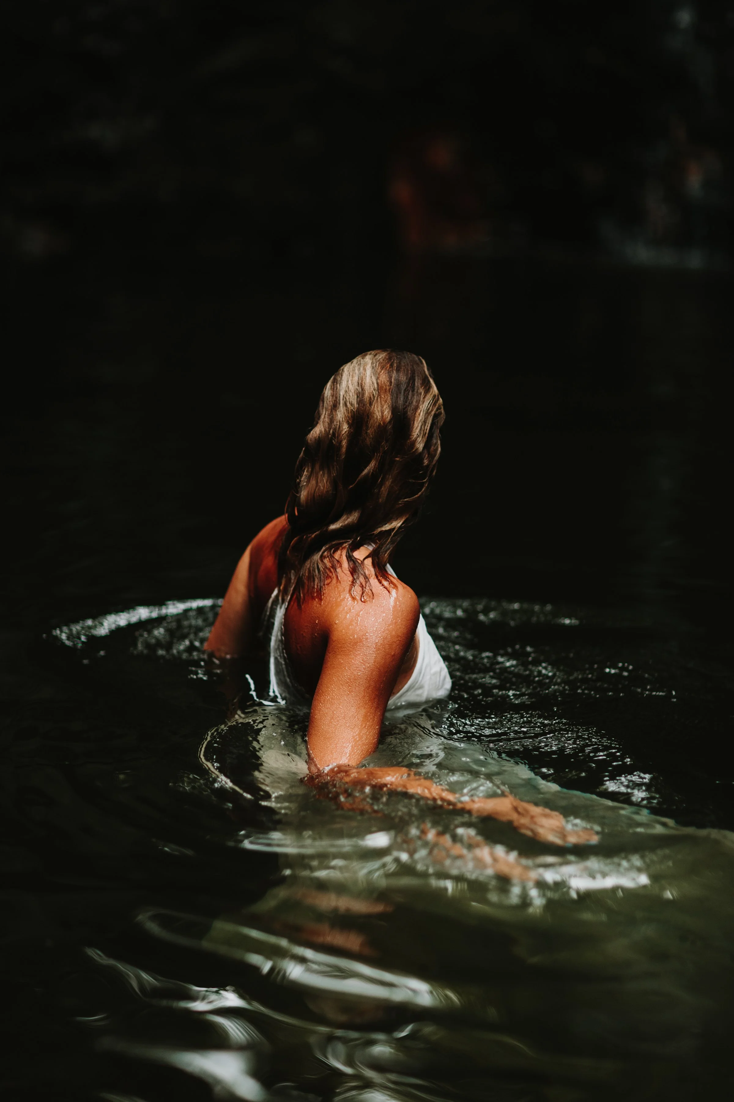 women in waterfall during hudson valley engagement photography shoot