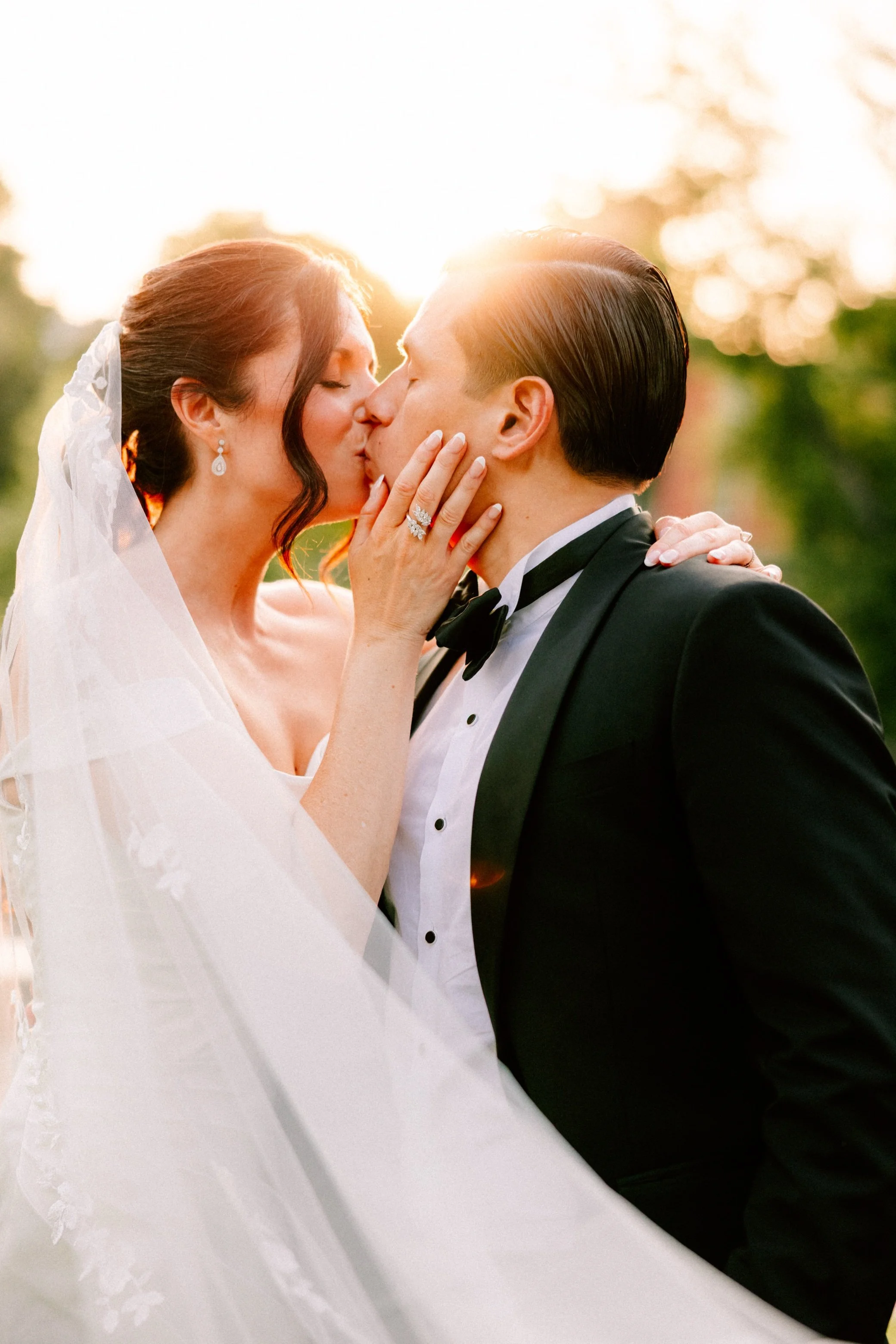 bride and groom kiss during golden hour at The Roundhouse in Beacon, NY