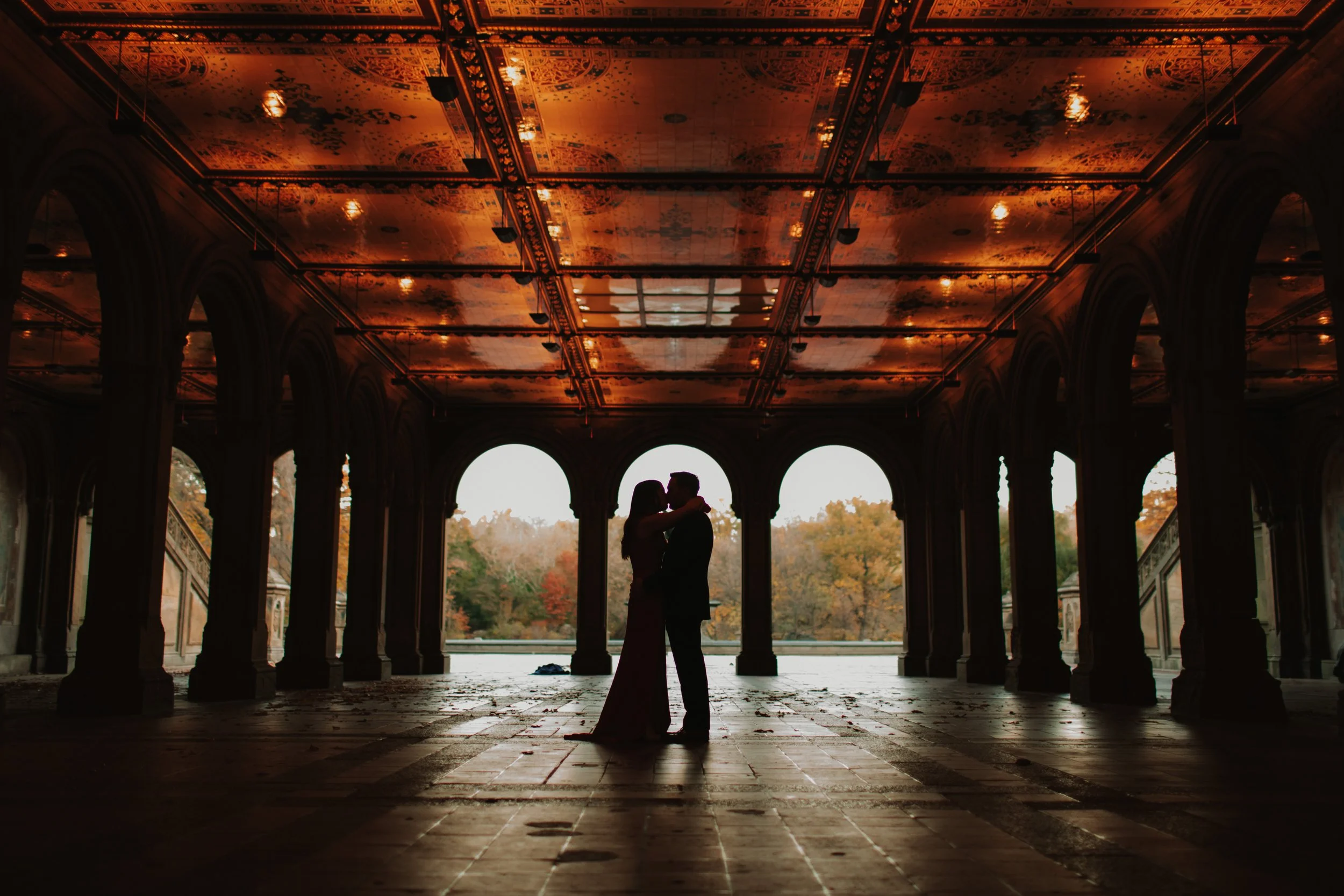 couple in Bethesda terrace during their engagement photo shoot