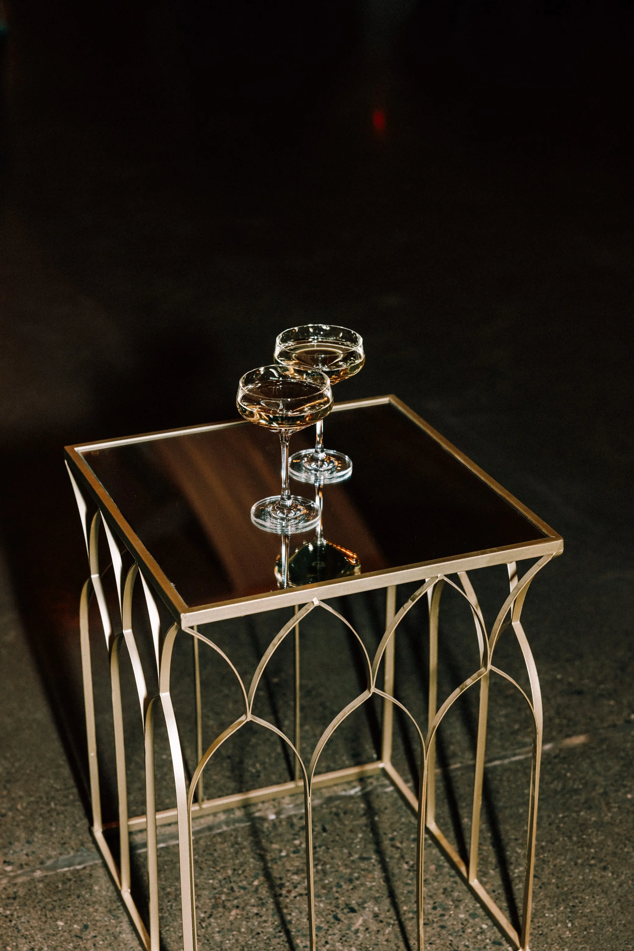 photograph of champagne coupes on mirrored table for wedding toasts at glenmere mansion
