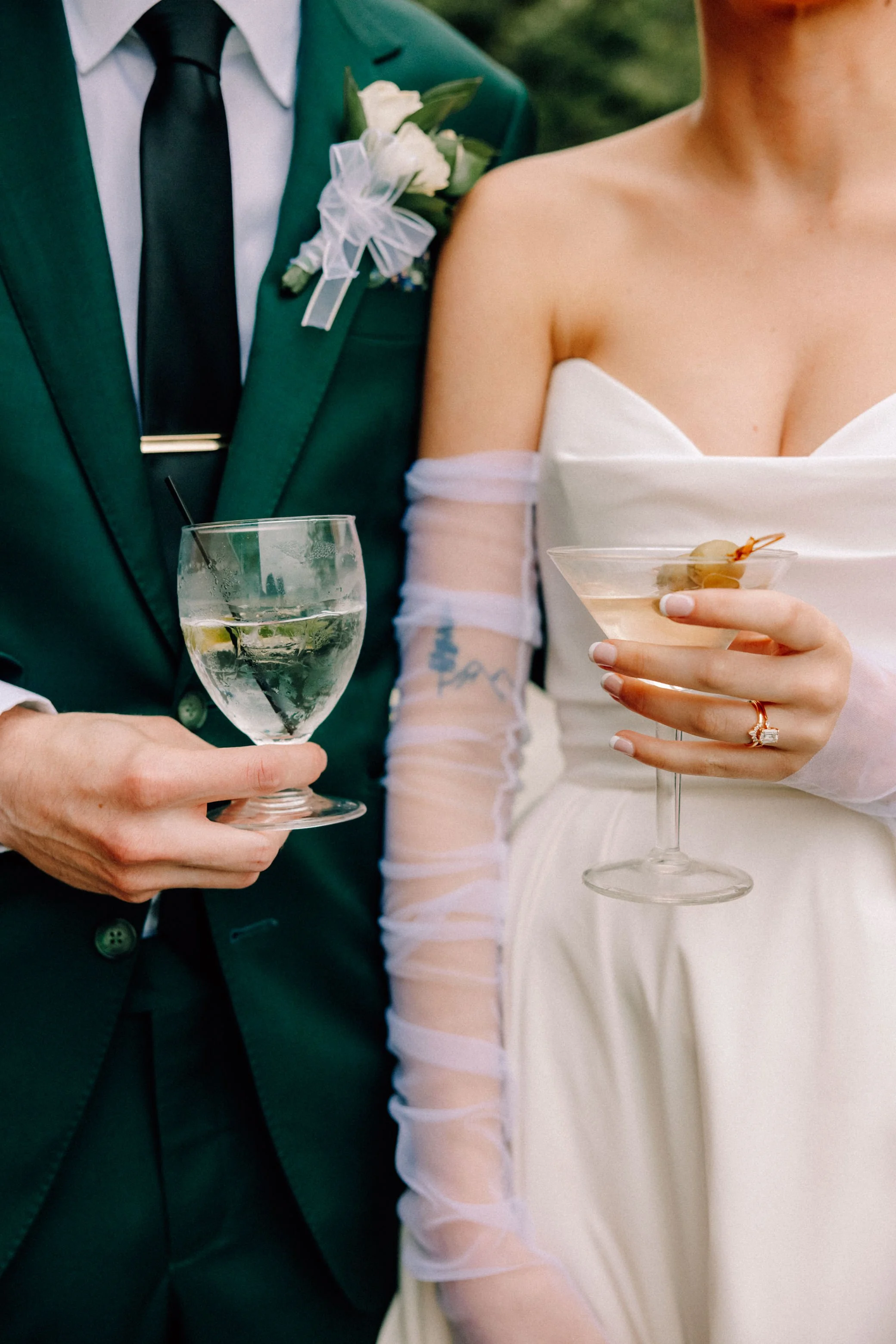 wedding couple hold their signature drinks at the garrison