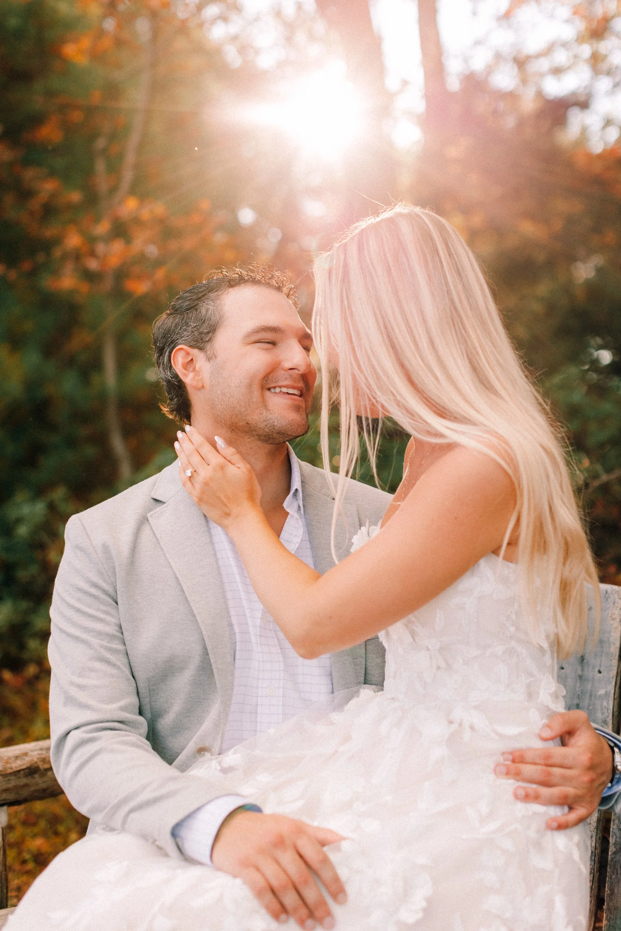 Couple sitting on a bench after their surprise proposal and engagement photo shoot at Mohonk Mountain House
