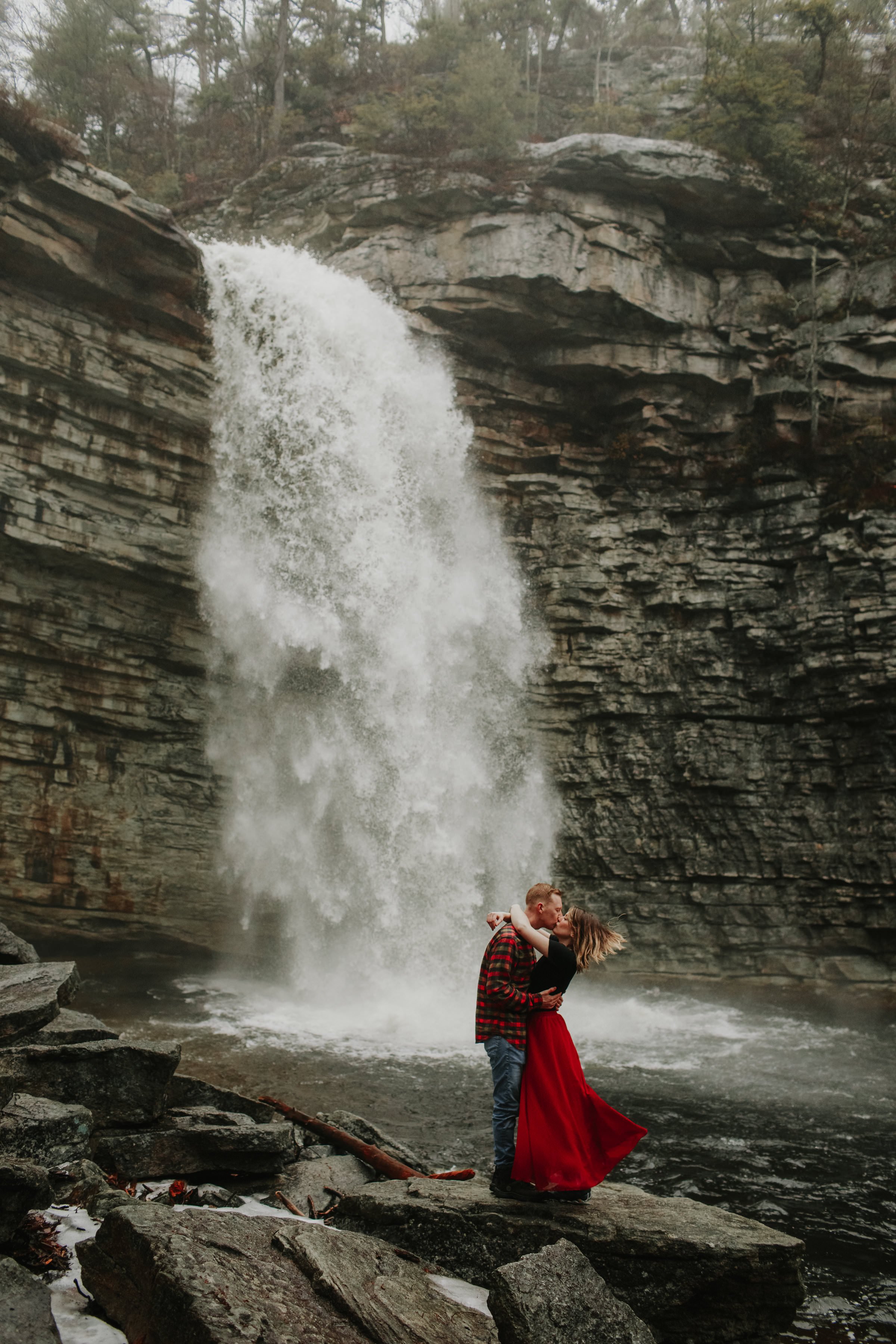 couple in front of Awosting Falls during their engagement photography shoot at Minnewaska State Park