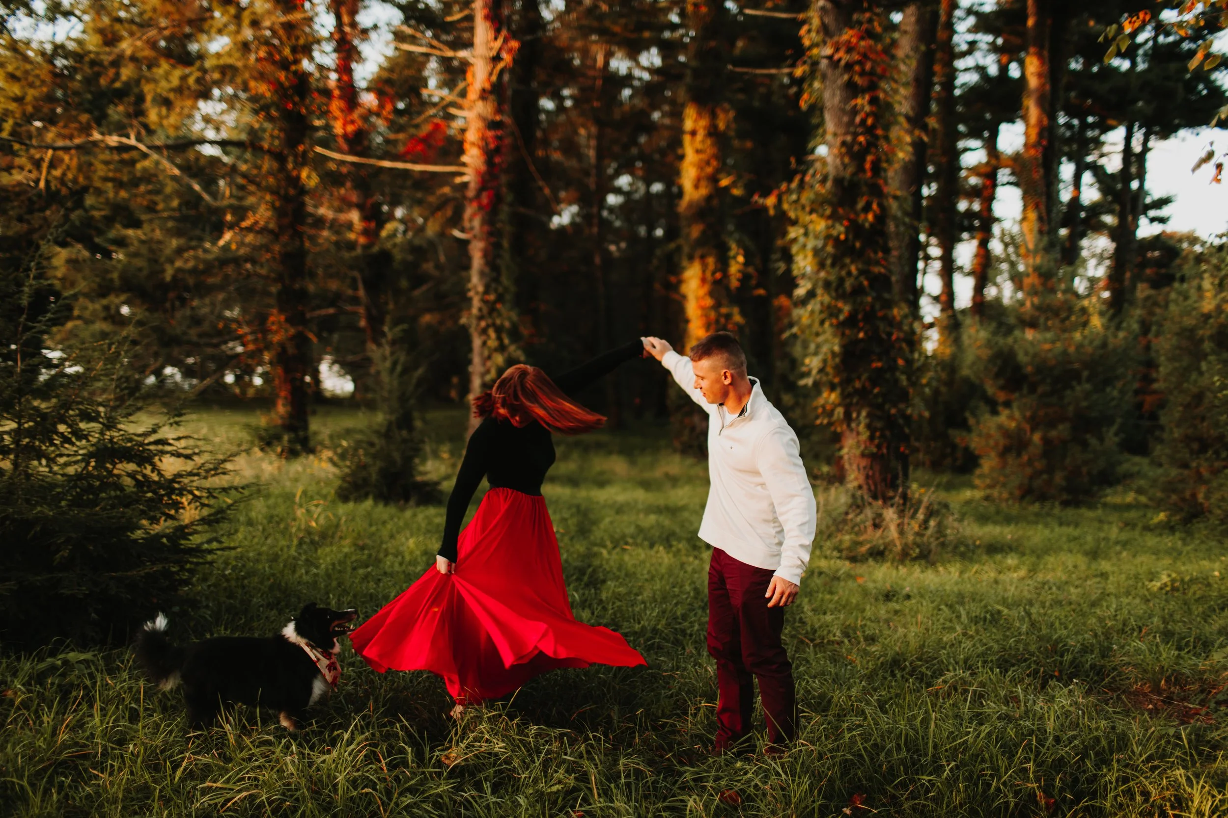 couple spinning during their engagement photo shoot at Vanderbilt Mansion