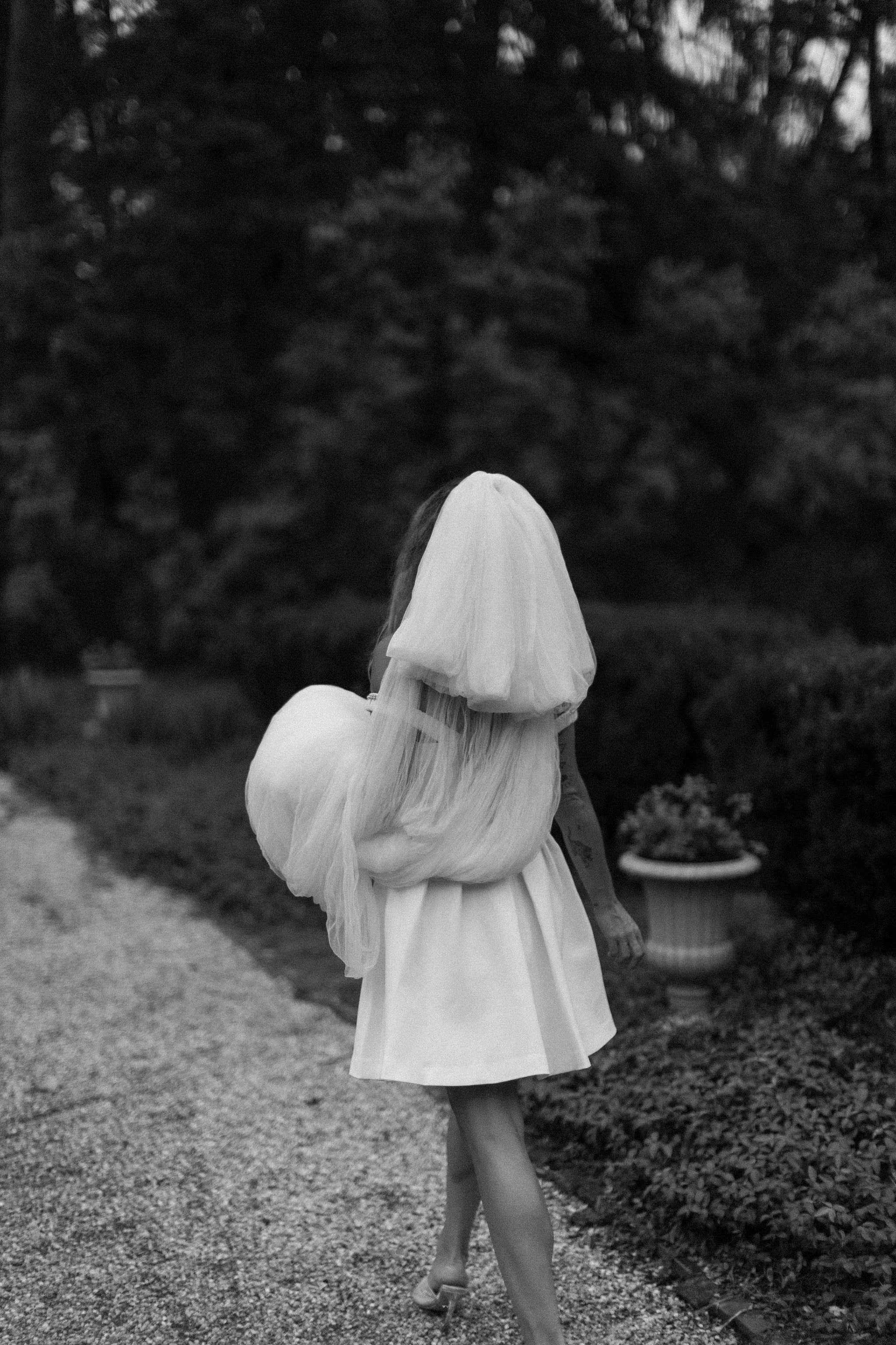 bride walking in garden during her hudson valley elopement