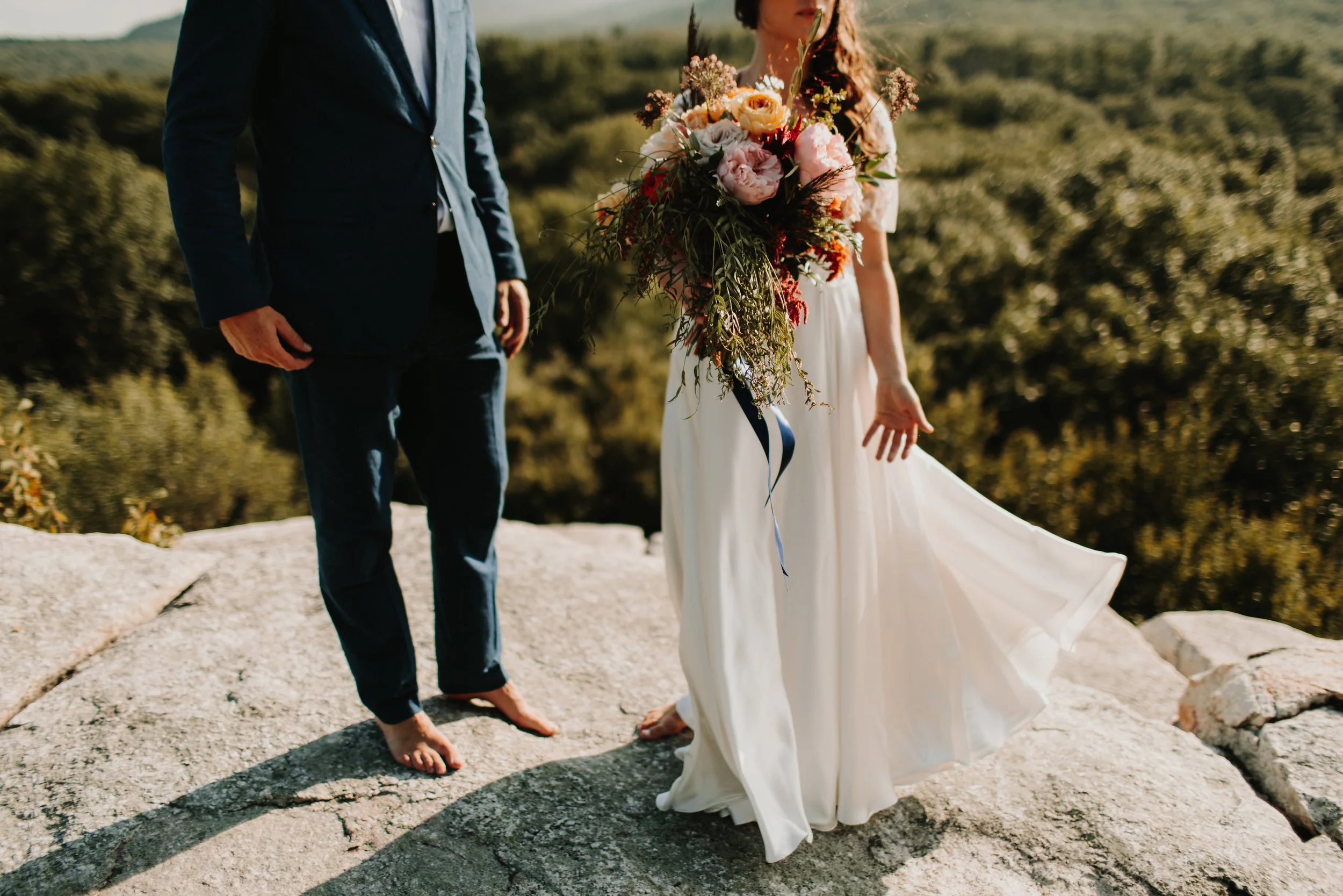 barefoot couple standing on the rocks of mohonk mountain during their elopement