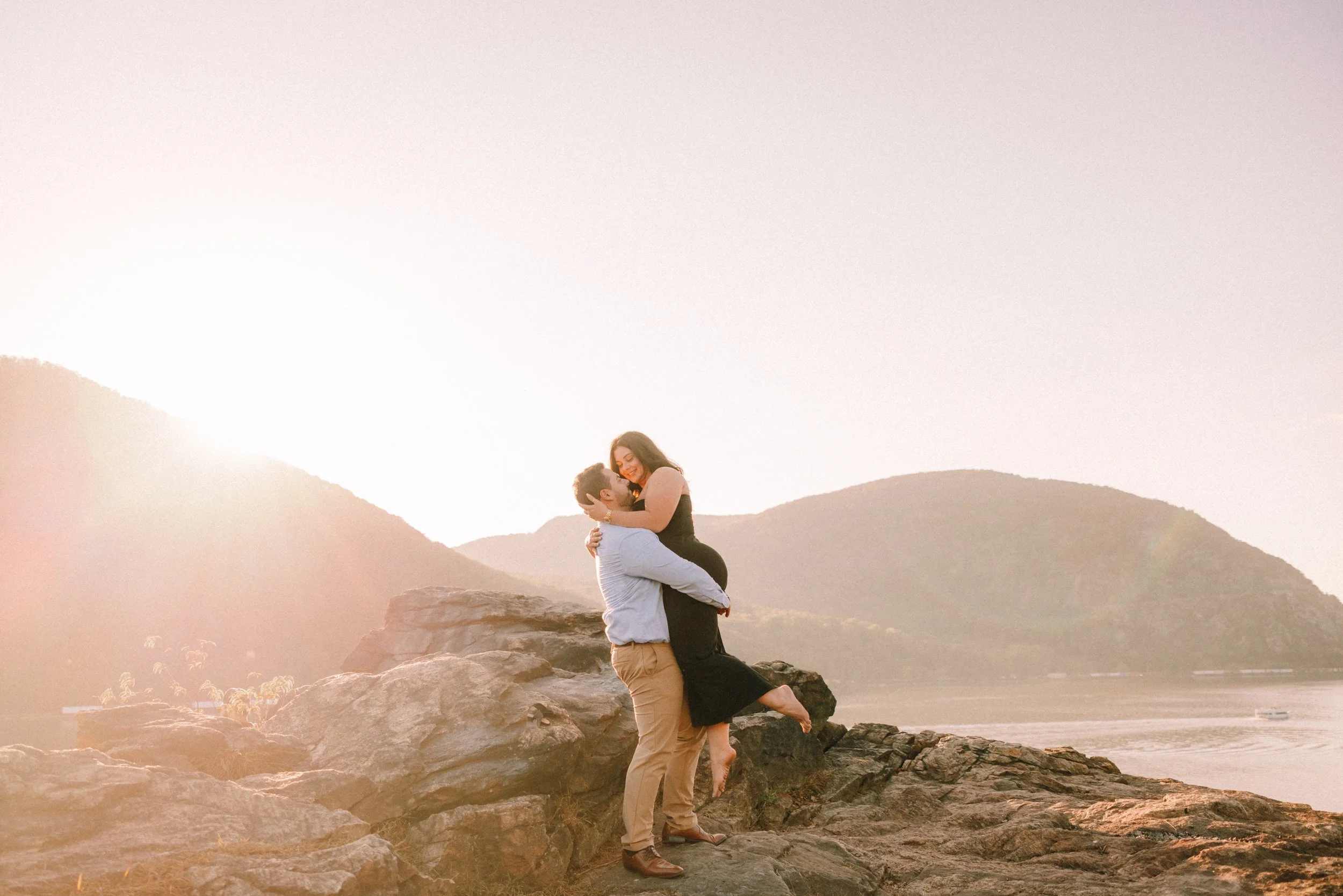 Engaged couple on the cliffs of Little Stony Point after their surprise proposal