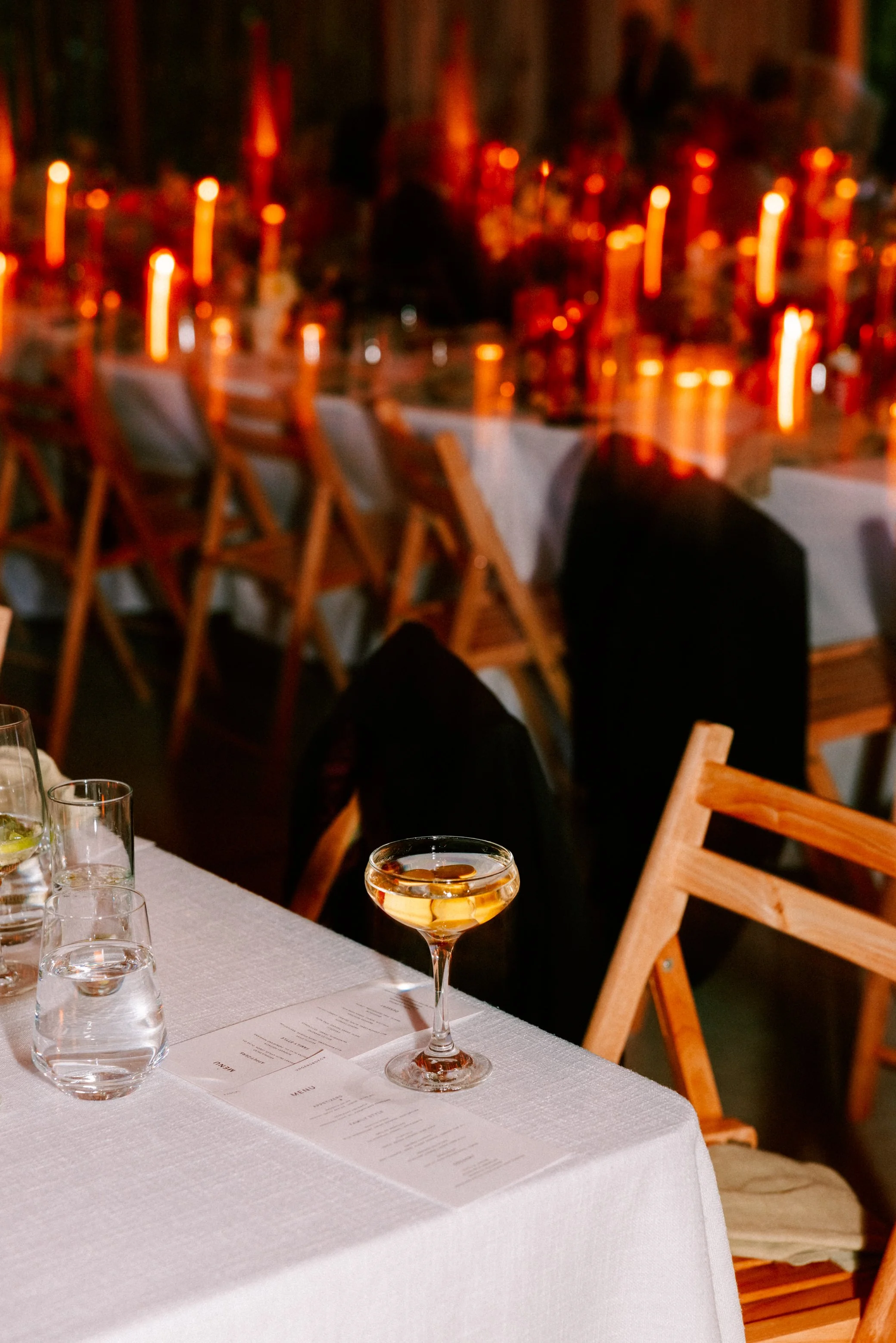 wedding photograph of a martini glass left on the dinner table at gather greene