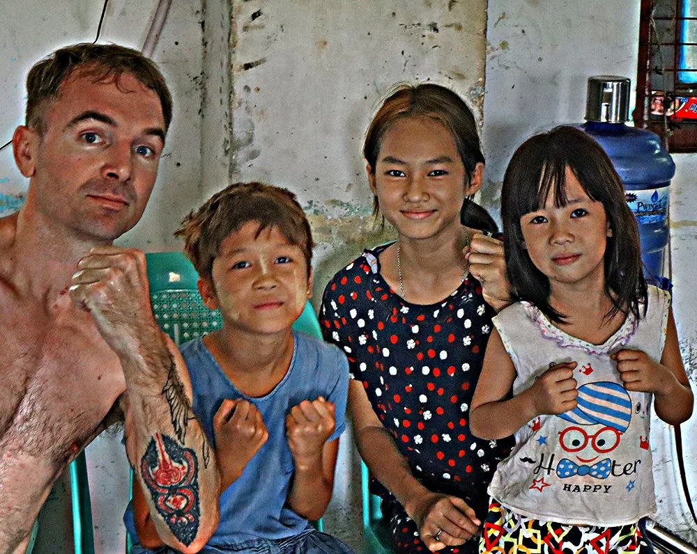 Daniel Hodges co founding member and outreach representative. With the kids at Coach Richards Gym - MK 1 Lethwei - Yangon Myanmar