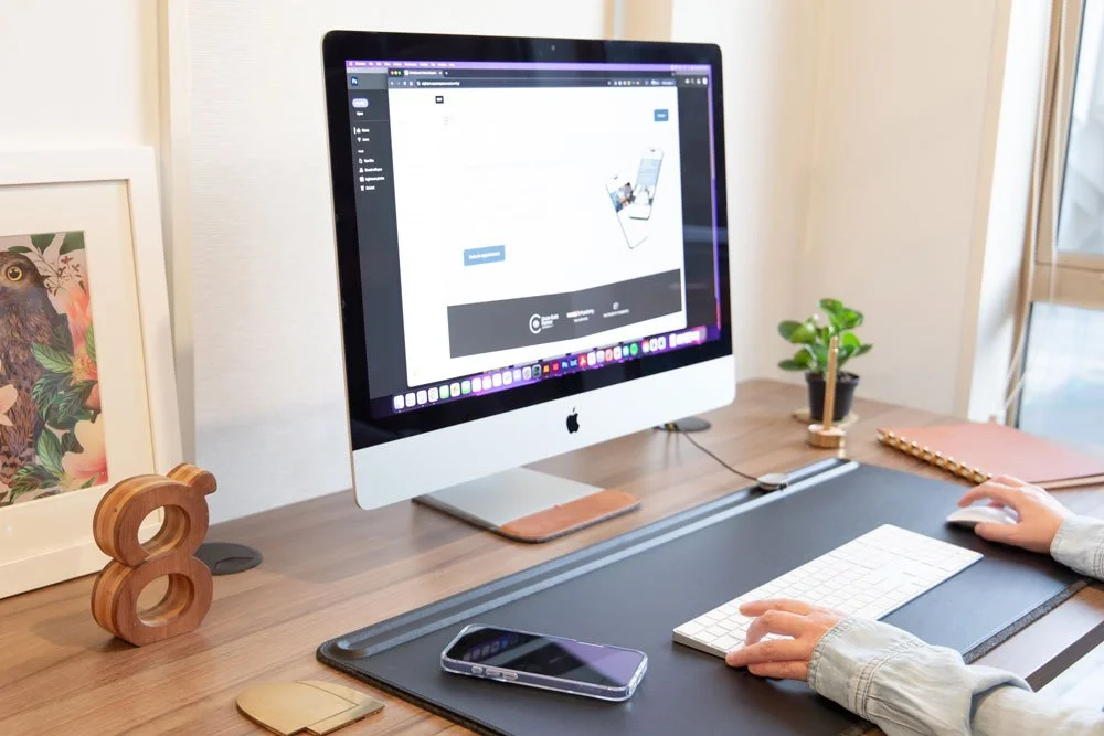 elaina designer working on desktop computer website design