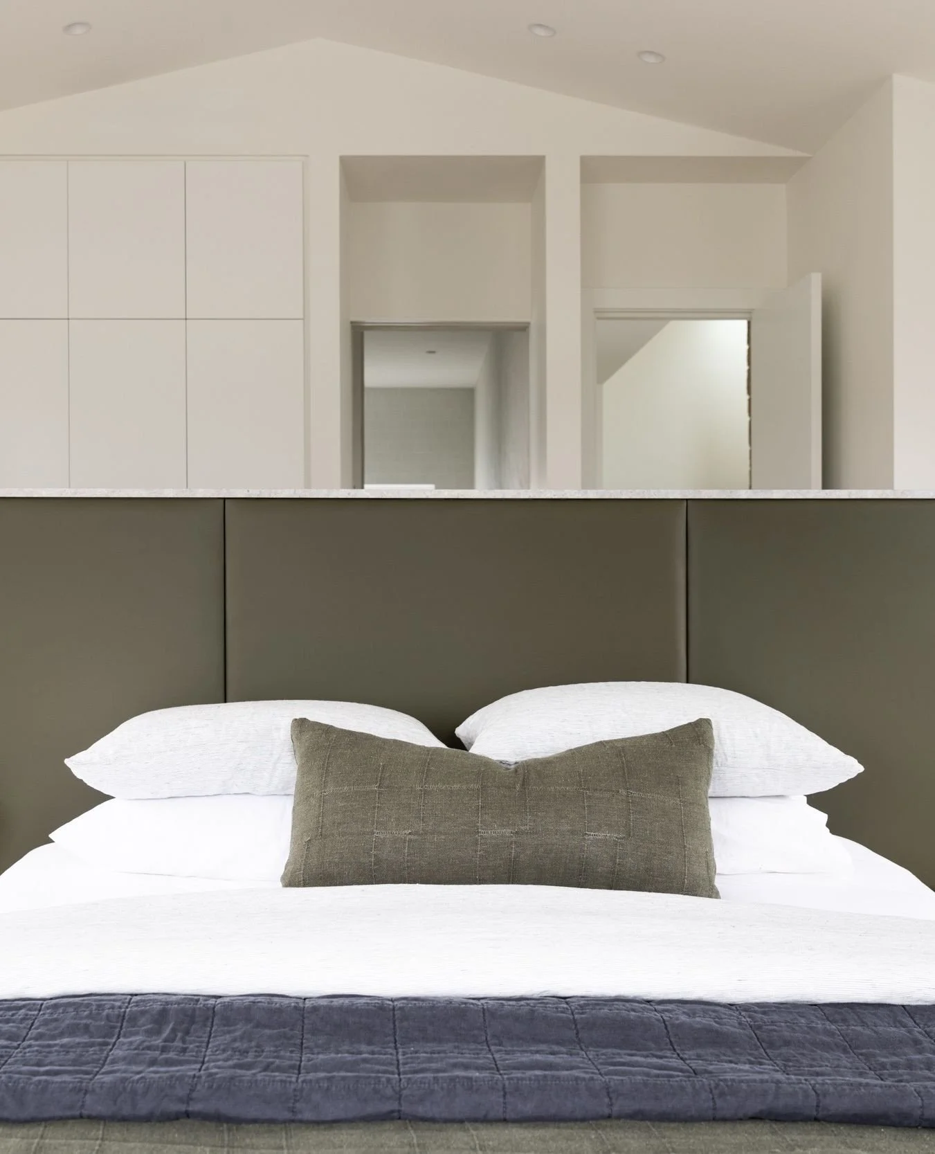 A calm retreat on the coast⁠
In contrast to the lively family zones elsewhere in the home, the main bedroom at our North Avoca Beach House was designed as a space to slow down. A place to read, rest and reconnect.⁠
⁠
A custom olive leather bedhead an