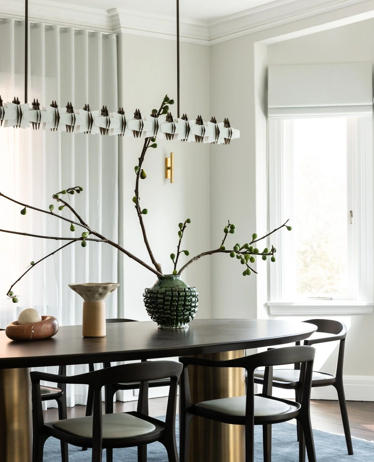 One of our favourite spaces from our Edgecliff Art Deco Apartment project.⁠
⁠
This dining room is a balance of old and new, where contemporary furniture and sculptural lighting sit within the character and charm of the original heritage architecture.
