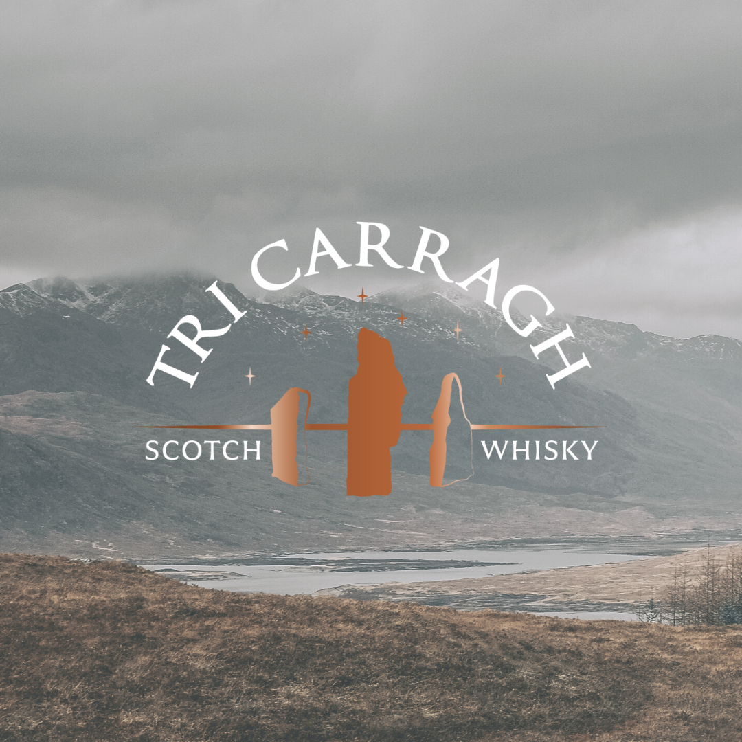 Logo for Tricarragh Scotch Whisky with mountain landscape background, featuring stylized rocks and stars.