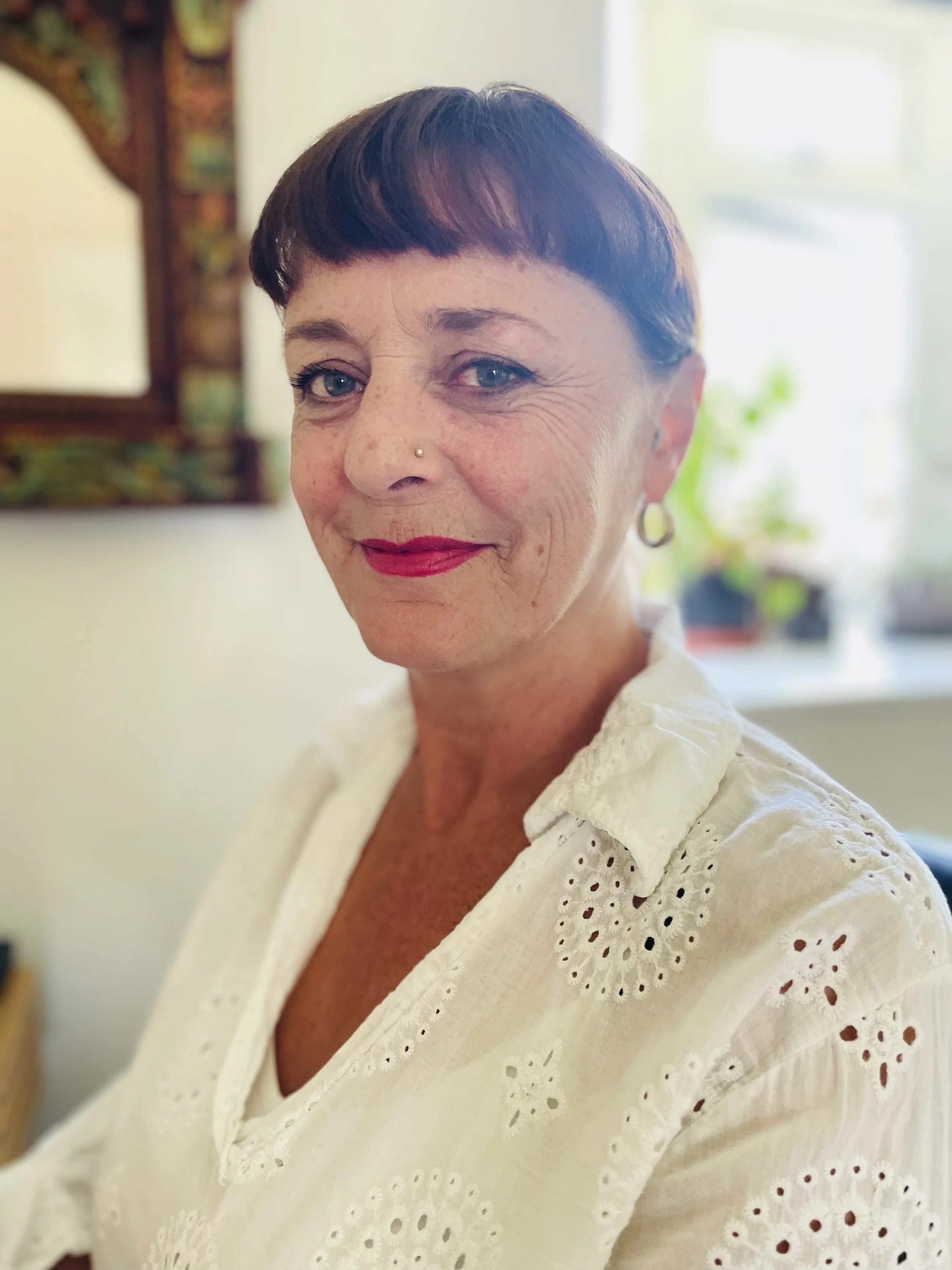 portrait of Geraldine Coffey, chronic pain coach and hypnotherapist, looking directly at the camera.