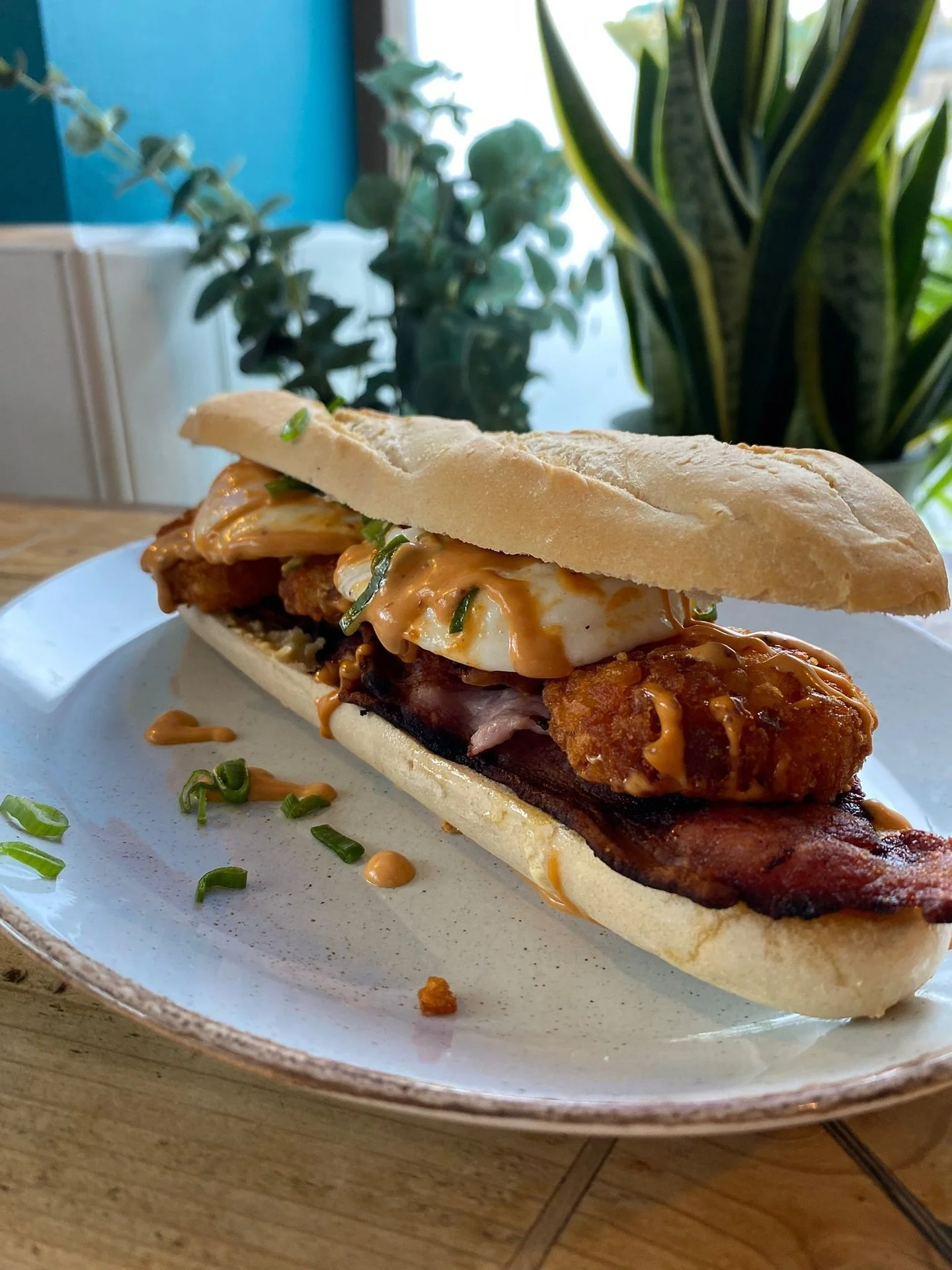 We&rsquo;d like to introduce you to our little friend. He&rsquo;s part dinosaur head, part breakfast, part &ldquo;most epic sandwich you&rsquo;ve ever put in your mouth&rdquo;. If you can even fit it in&hellip; 🦖🐊
Meet &ldquo;The Morning Blues Brea
