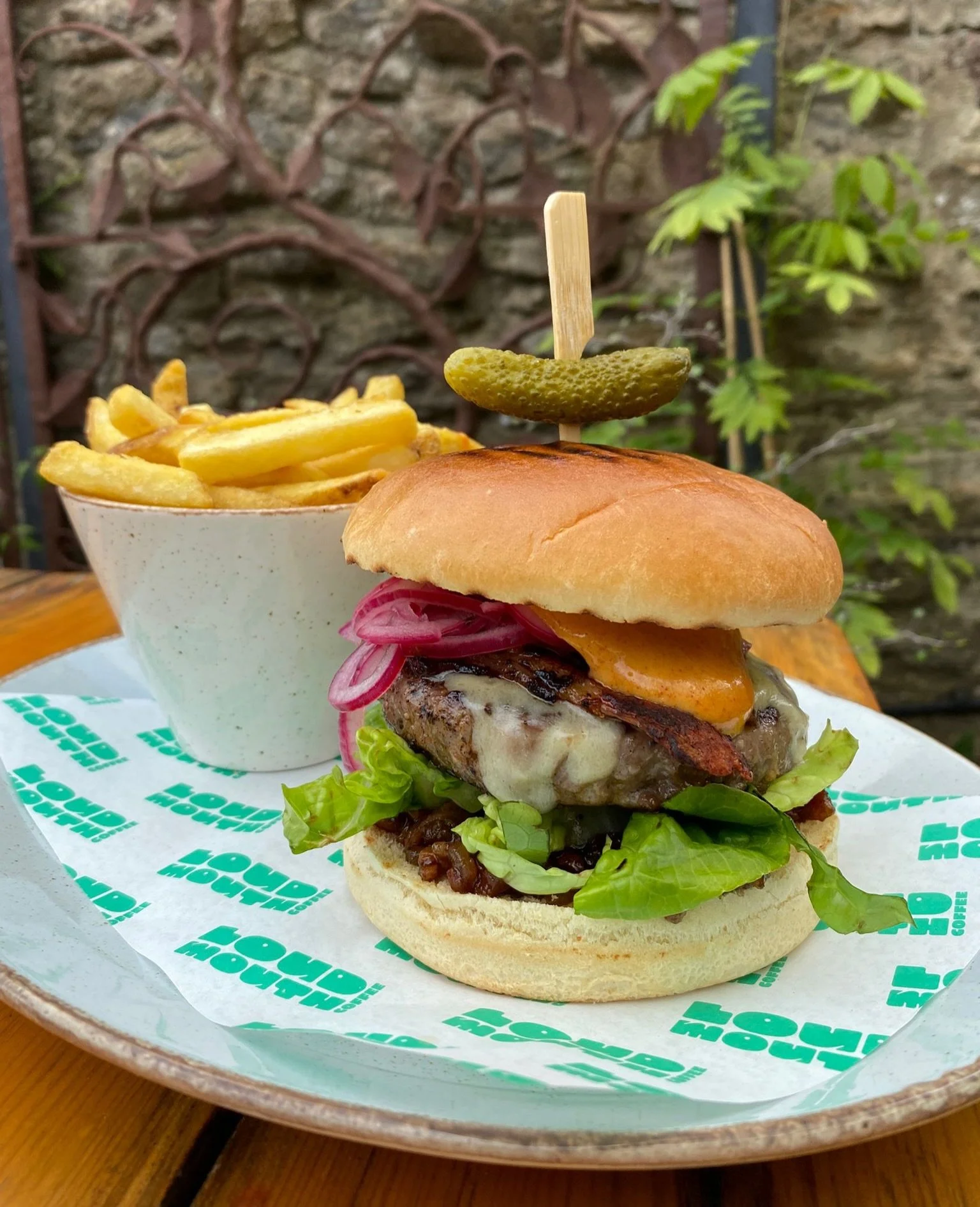SPOTLIGHT ON THIS BEAST OF A BURGER ☀️🔦

Currently on our summer specials menu, looking fine and tasting even finer. Have this Big Mouth Burger with extra bacon, fries, or even a beer. It&rsquo;s bank holiday weekend. Why not? 🍔🍔🍔

Toasted brioch