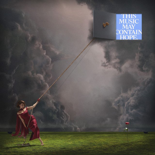 What is the symbolism behind Raye’s “This Music May Contain Hope” album cover?