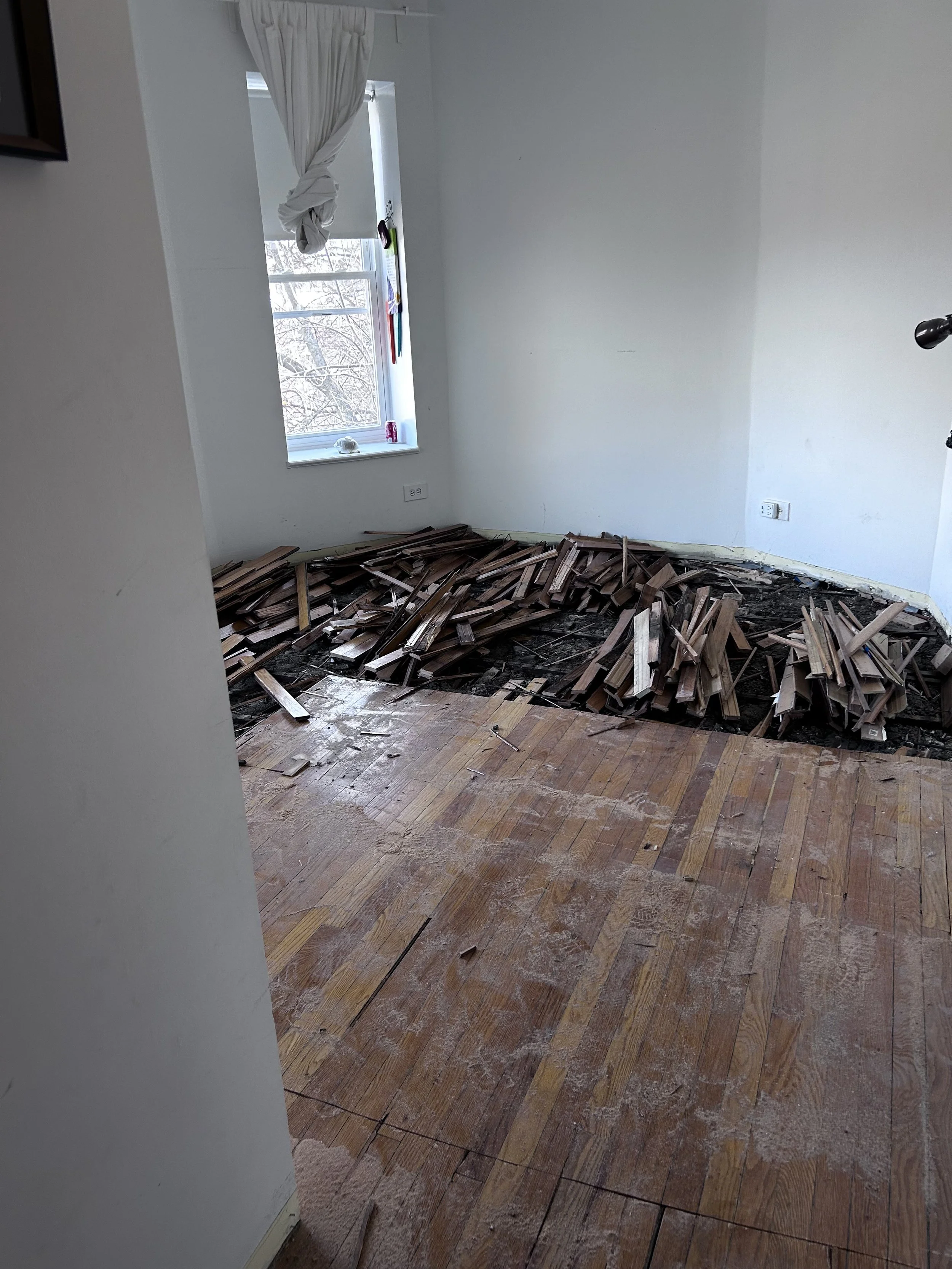 The kitchen floor demo was coordinated with the floor replacement work in the rest of the unit