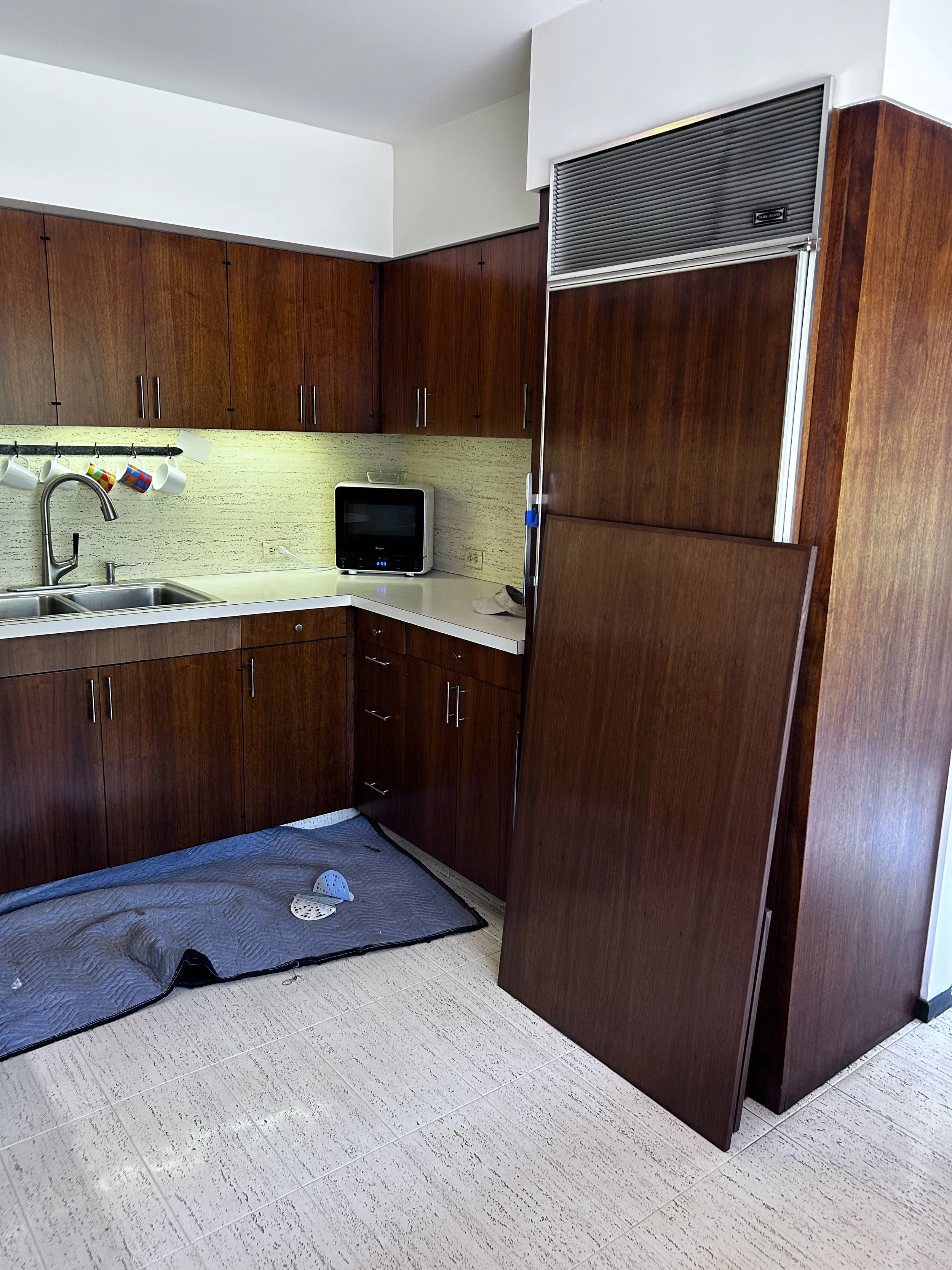 The existing end panels were refinished on site. 