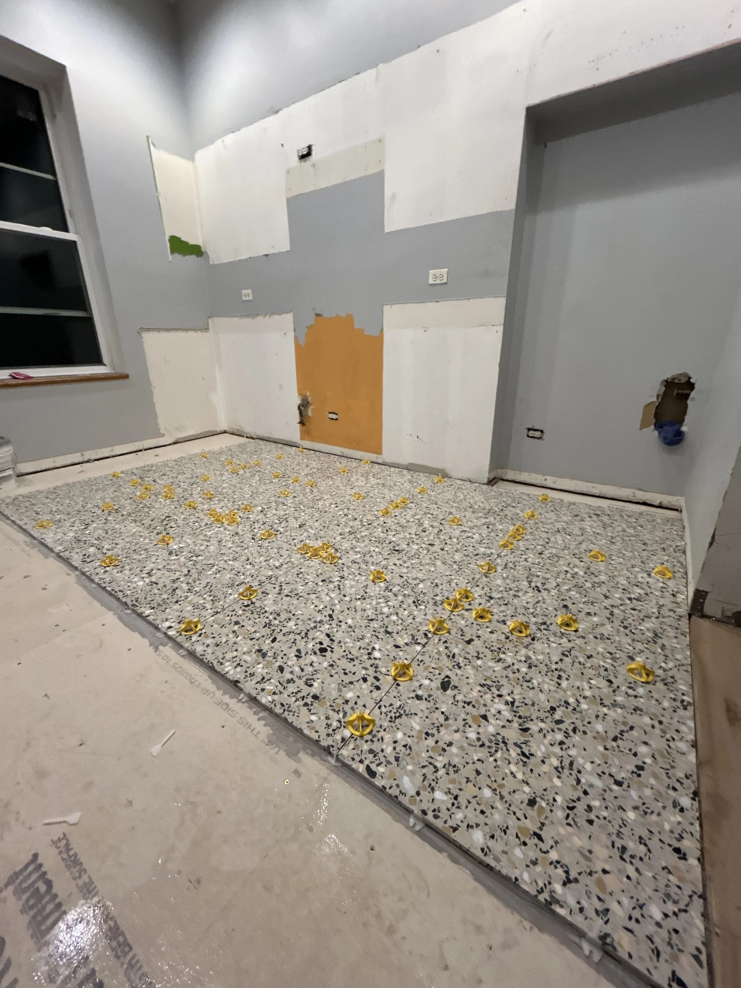 Laying down the new tile