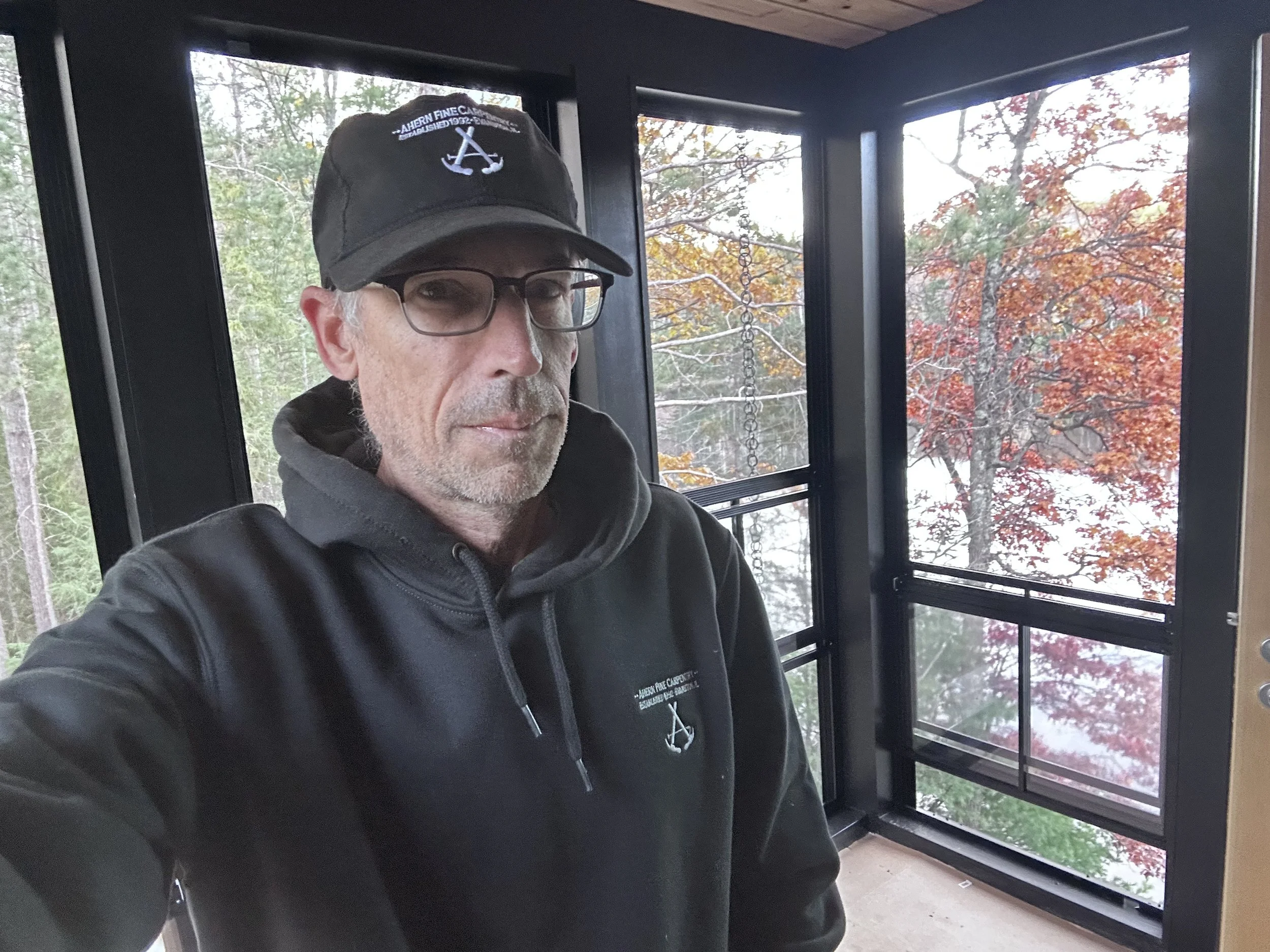 The windows slide down in an accordion fashion. Space saving and really efficient.