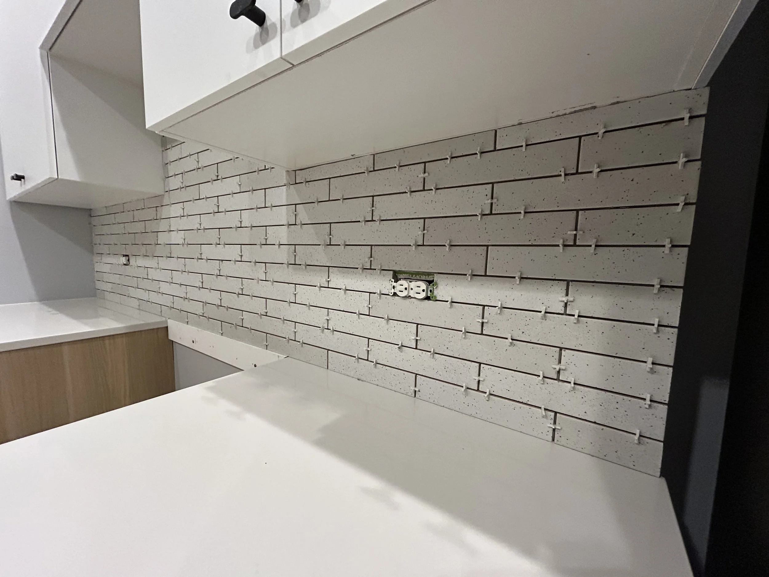 Backsplash tile behind the stove