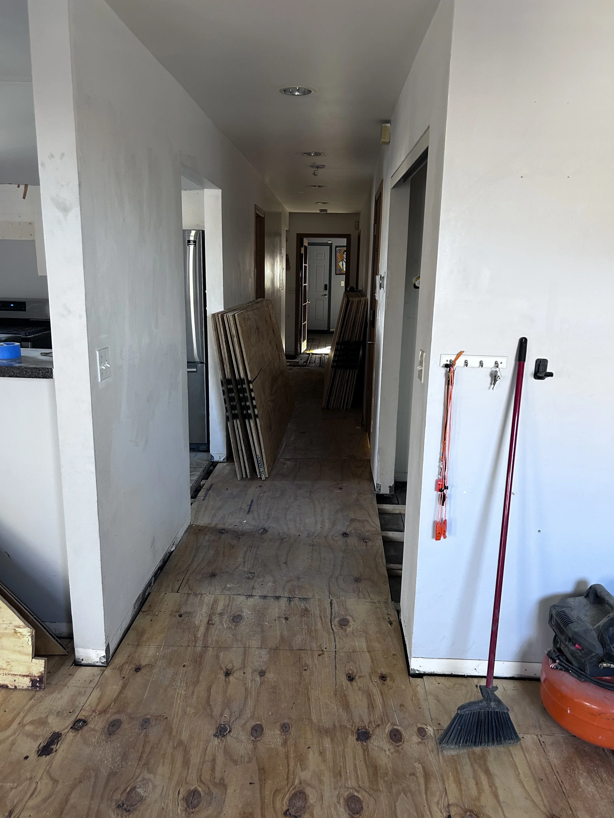 The kitchen floor demo was coordinated with the floor replacement work in the rest of the unit