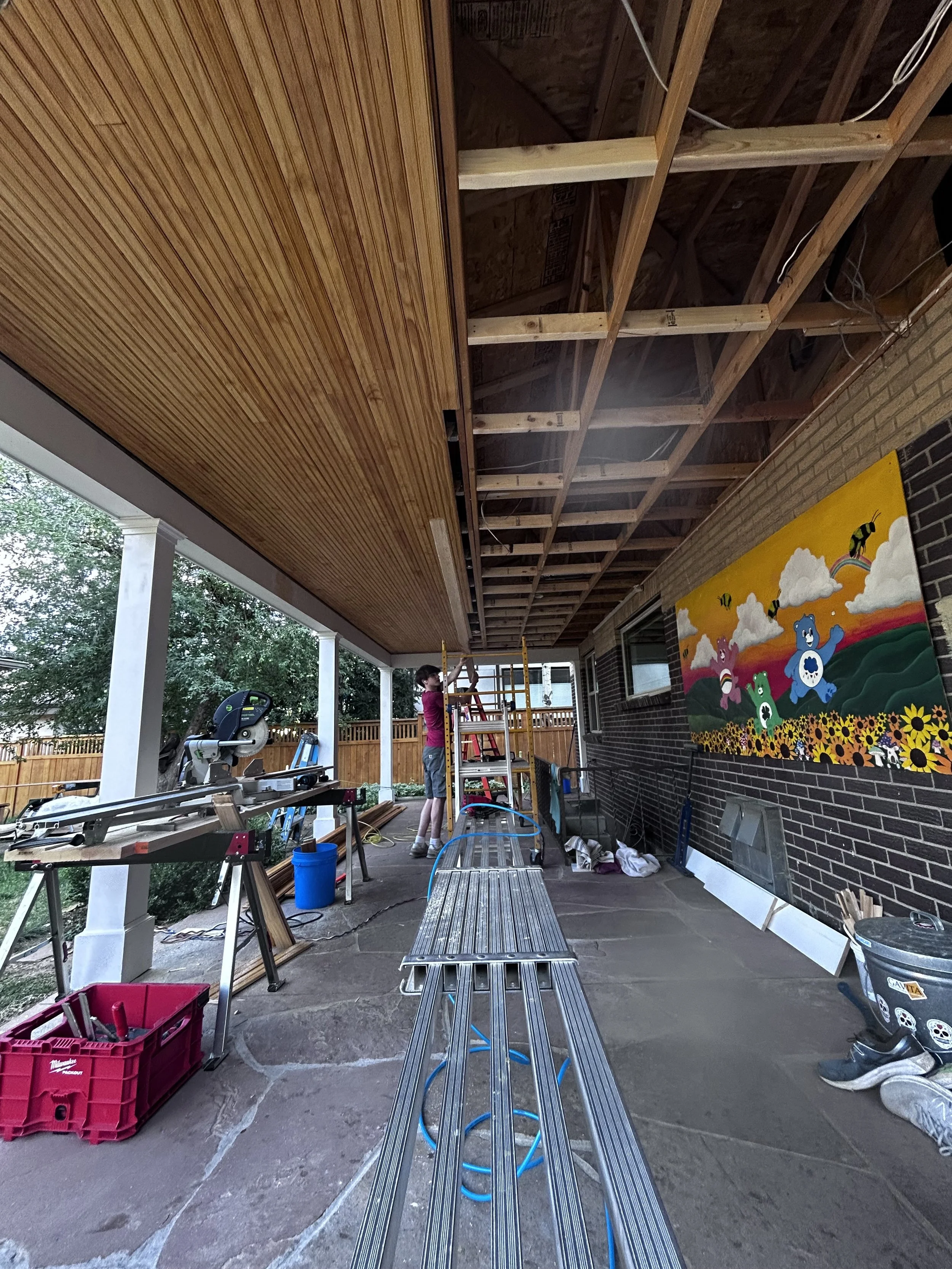 Installing the back porch bead board ceiling