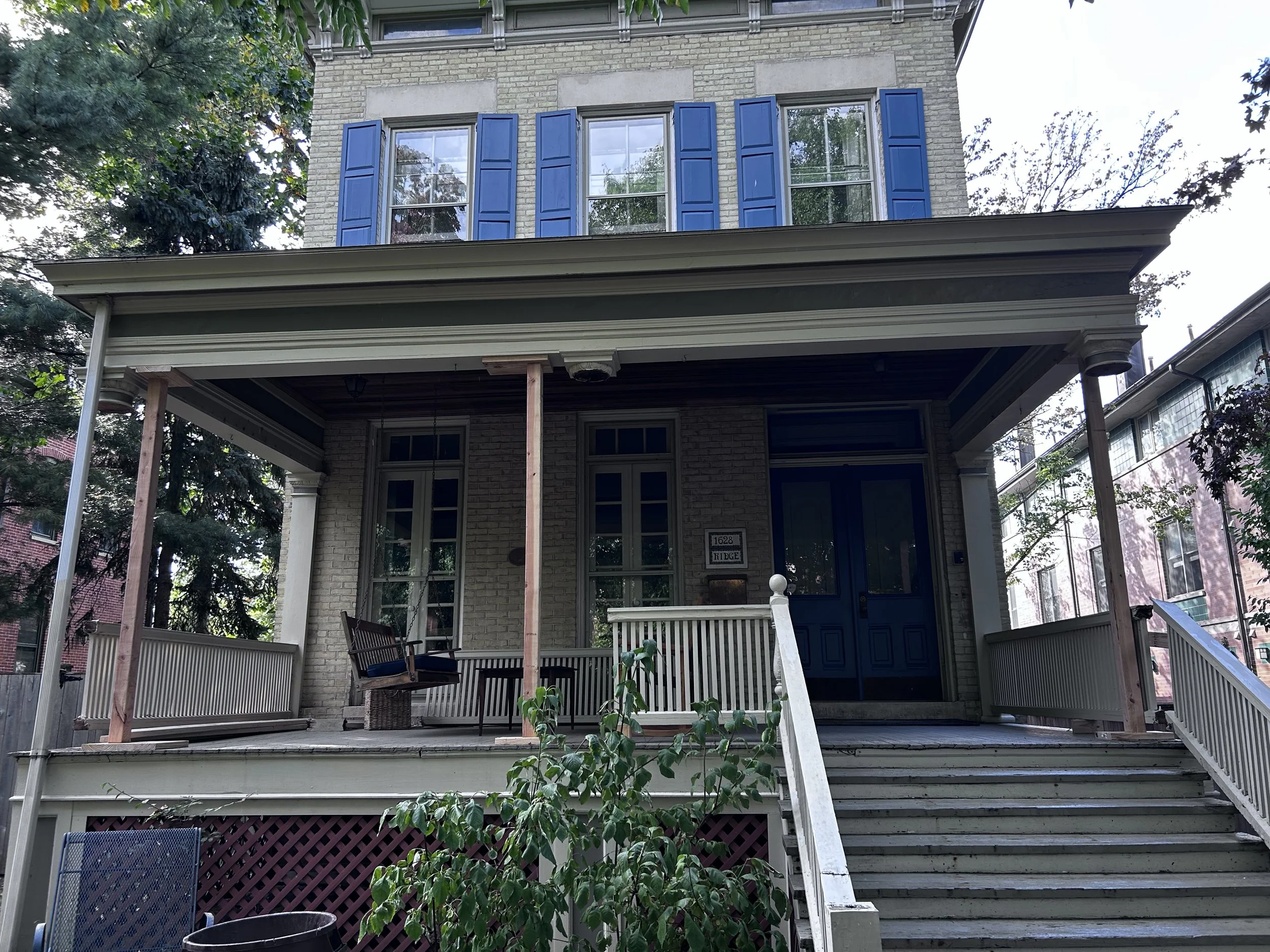 Porch roof supported while the columns get repaired