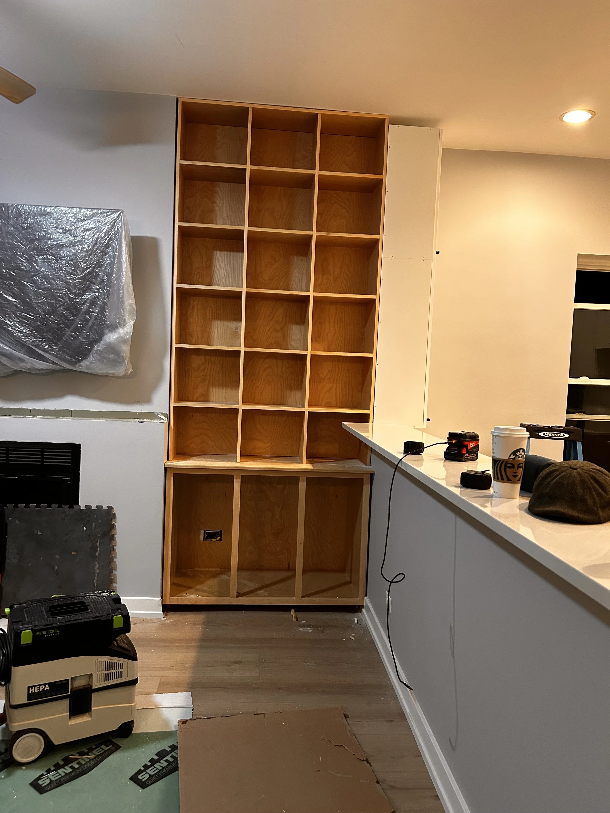 I carefully configured the built-in to align against the back of the new tall pantry cabinets in the kitchen