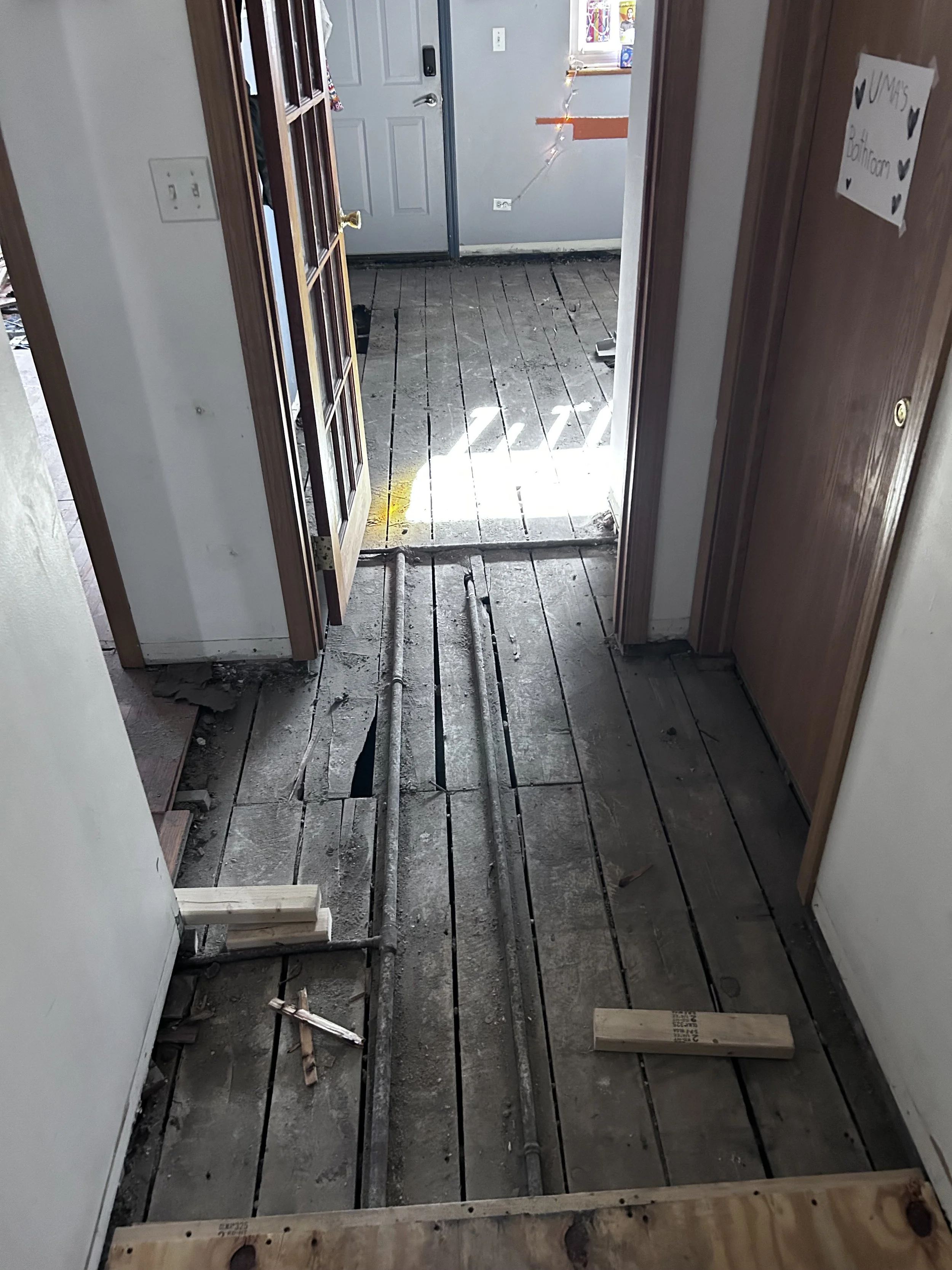 The kitchen floor demo was coordinated with the floor replacement work in the rest of the unit