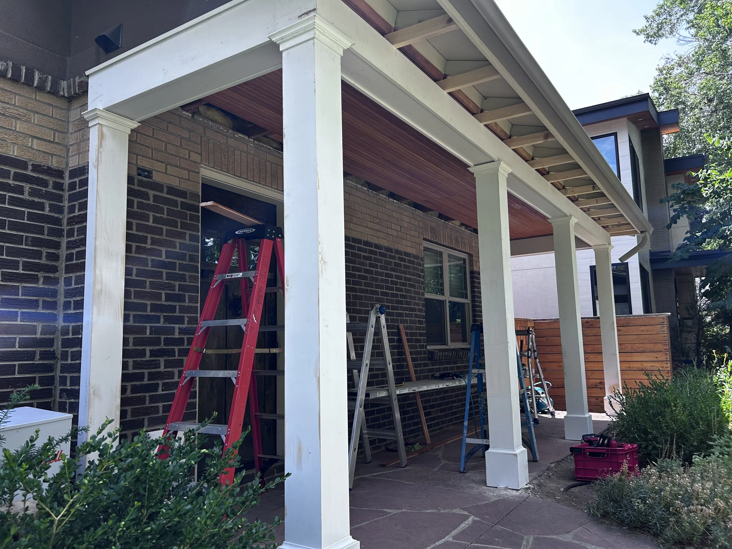 New fascia and trim at the column tops