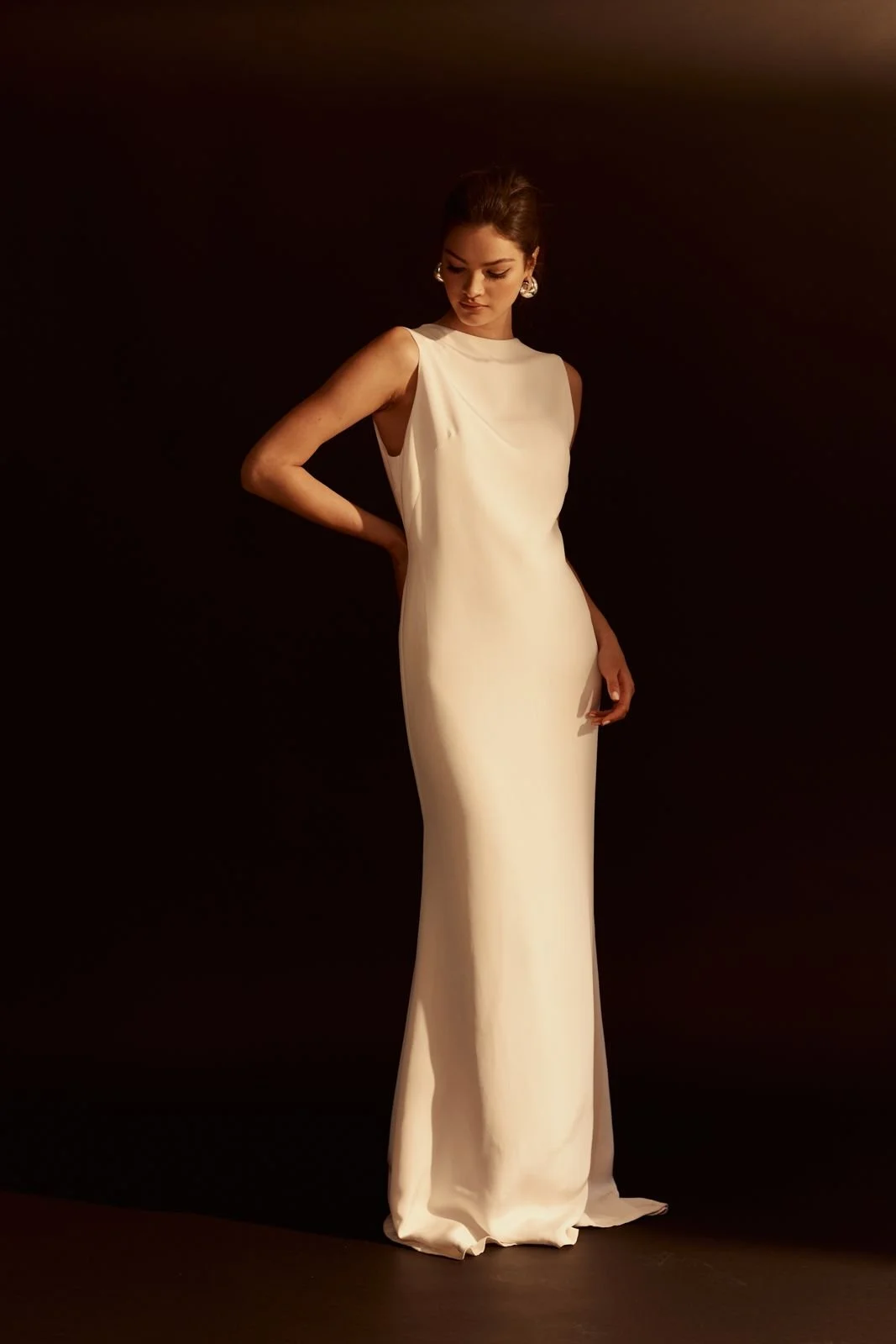 The simple, languid lines of the Giadi gown make it the perfect modern classic style. The column silhouette is made from draping silk that loosely skims over your curves and has an elegant open back. 

Book a fitting now to try Giadi.
#TheFallBride